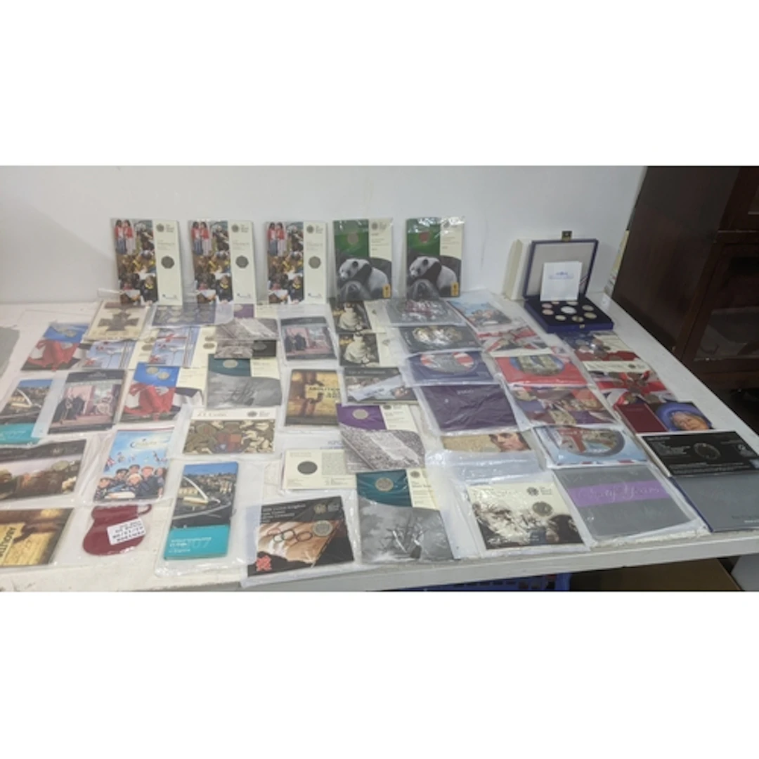 A collection of Royal Mint commemorative issue coins in seal...