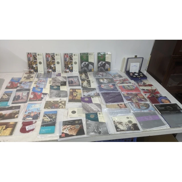 A collection of Royal Mint commemorative issue coins in seal...