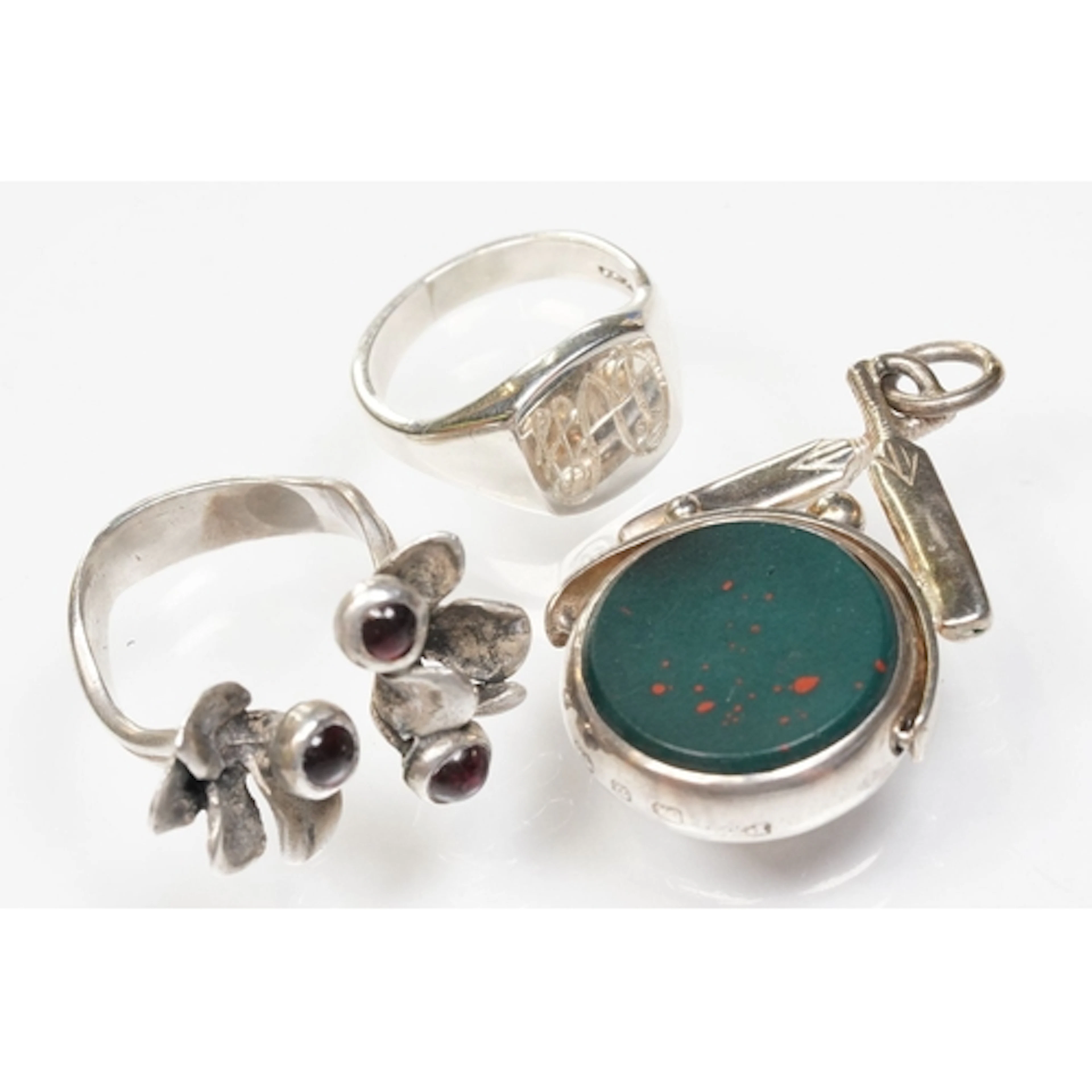 Group of silver items to include a silver watch fob with crc...