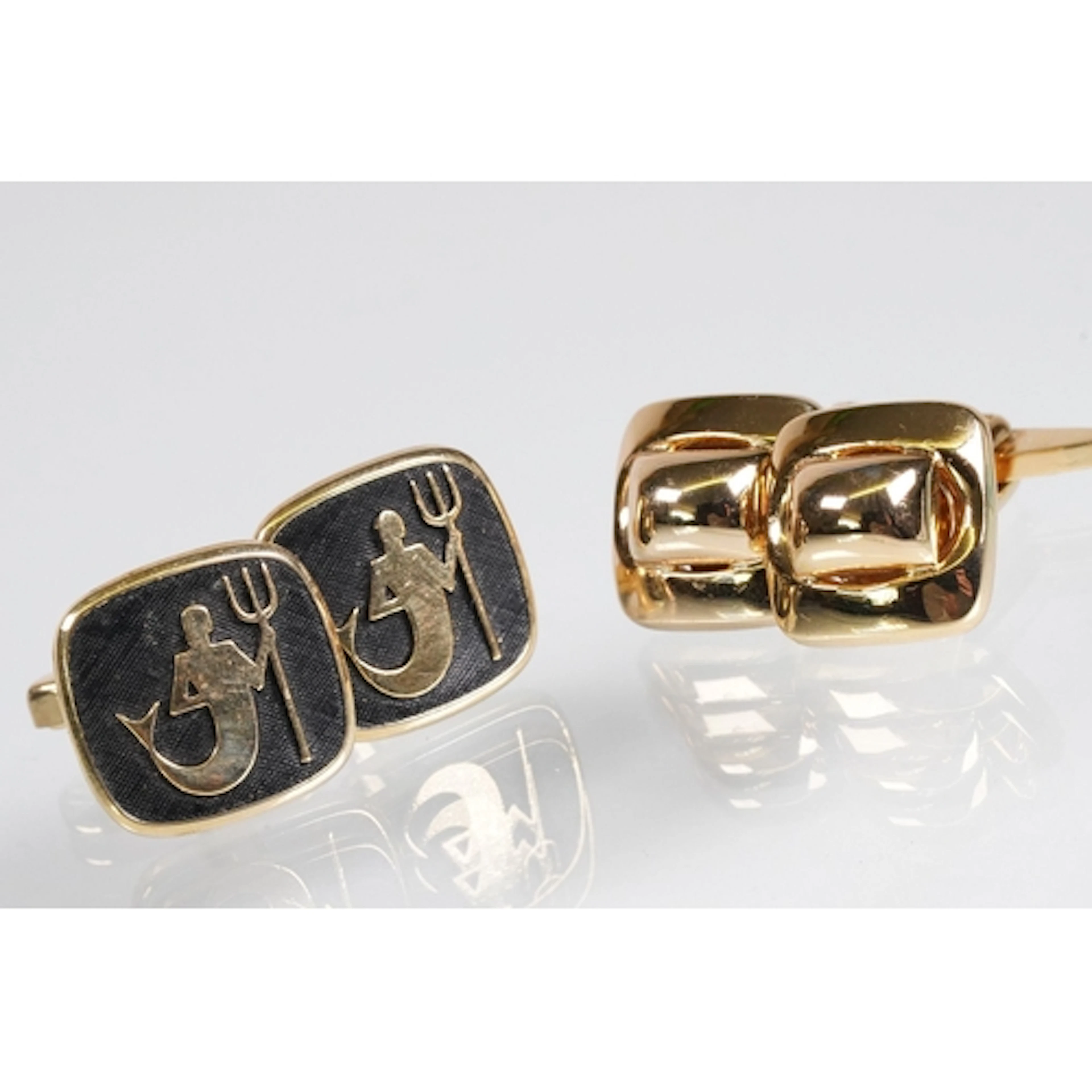 Pair of Christian Dior gold tone cufflinks (signed within ba...