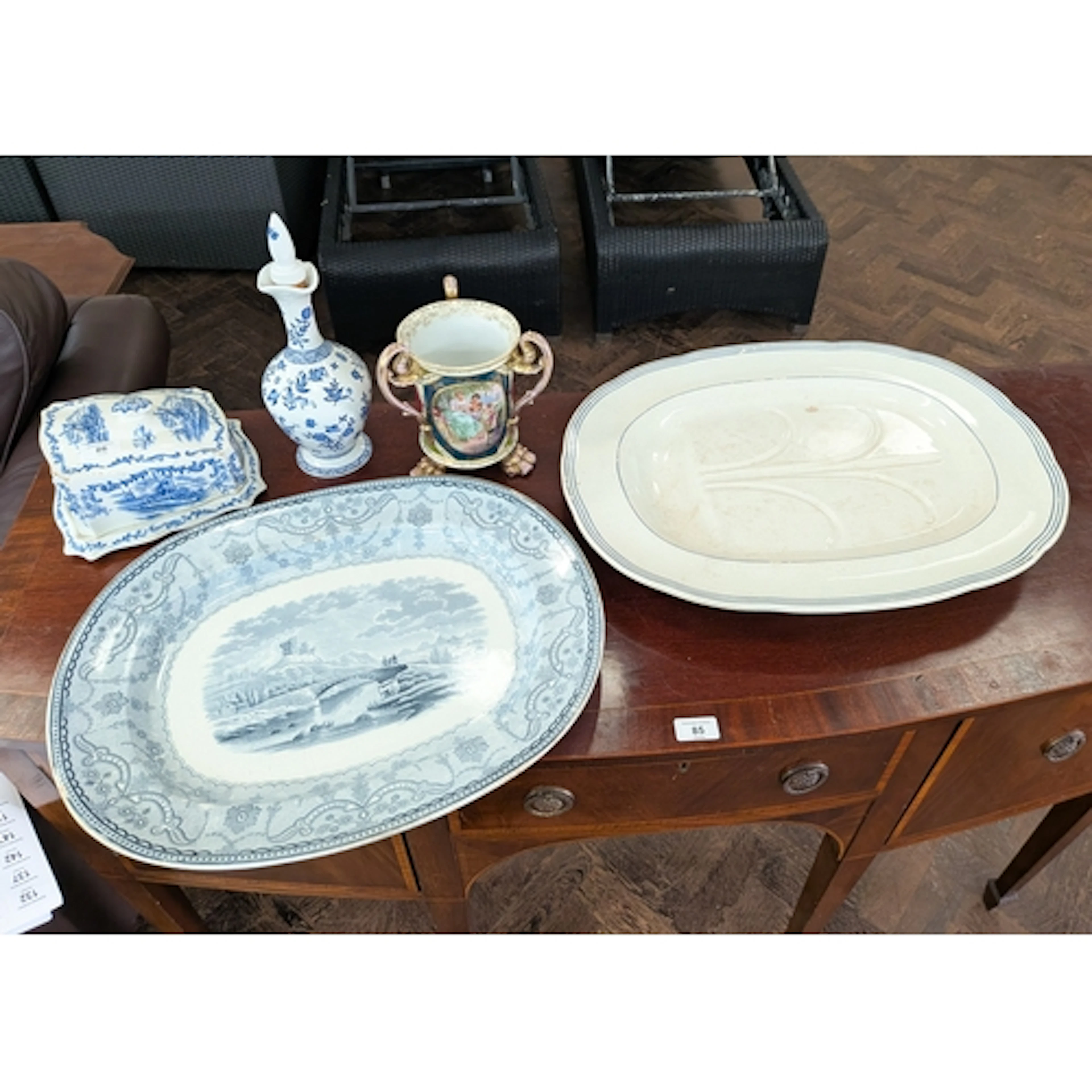 Two large china meat plates together with a blue and white c...