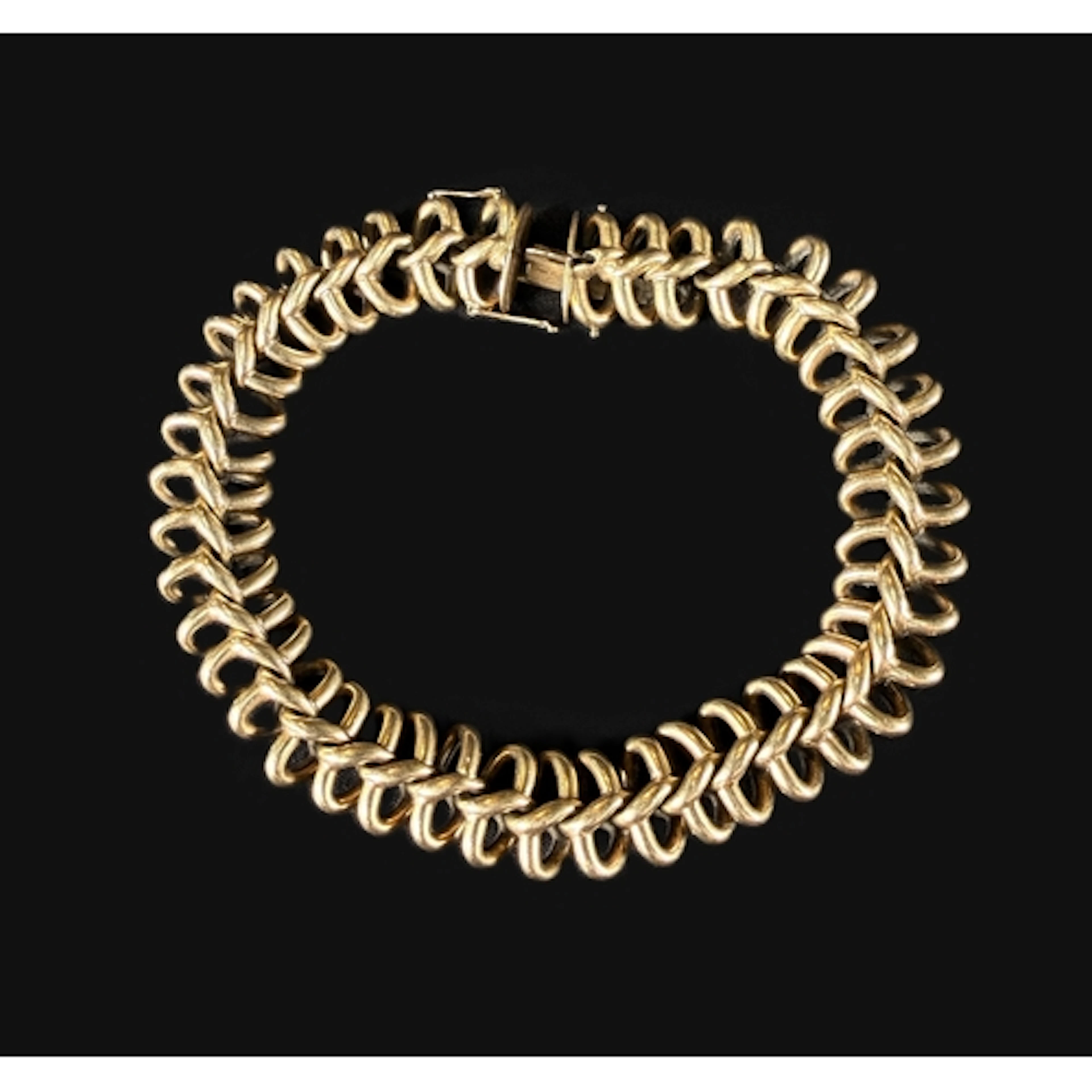 A yellow metal 'vertebrea'/ Spinal link chain vintage bracel...