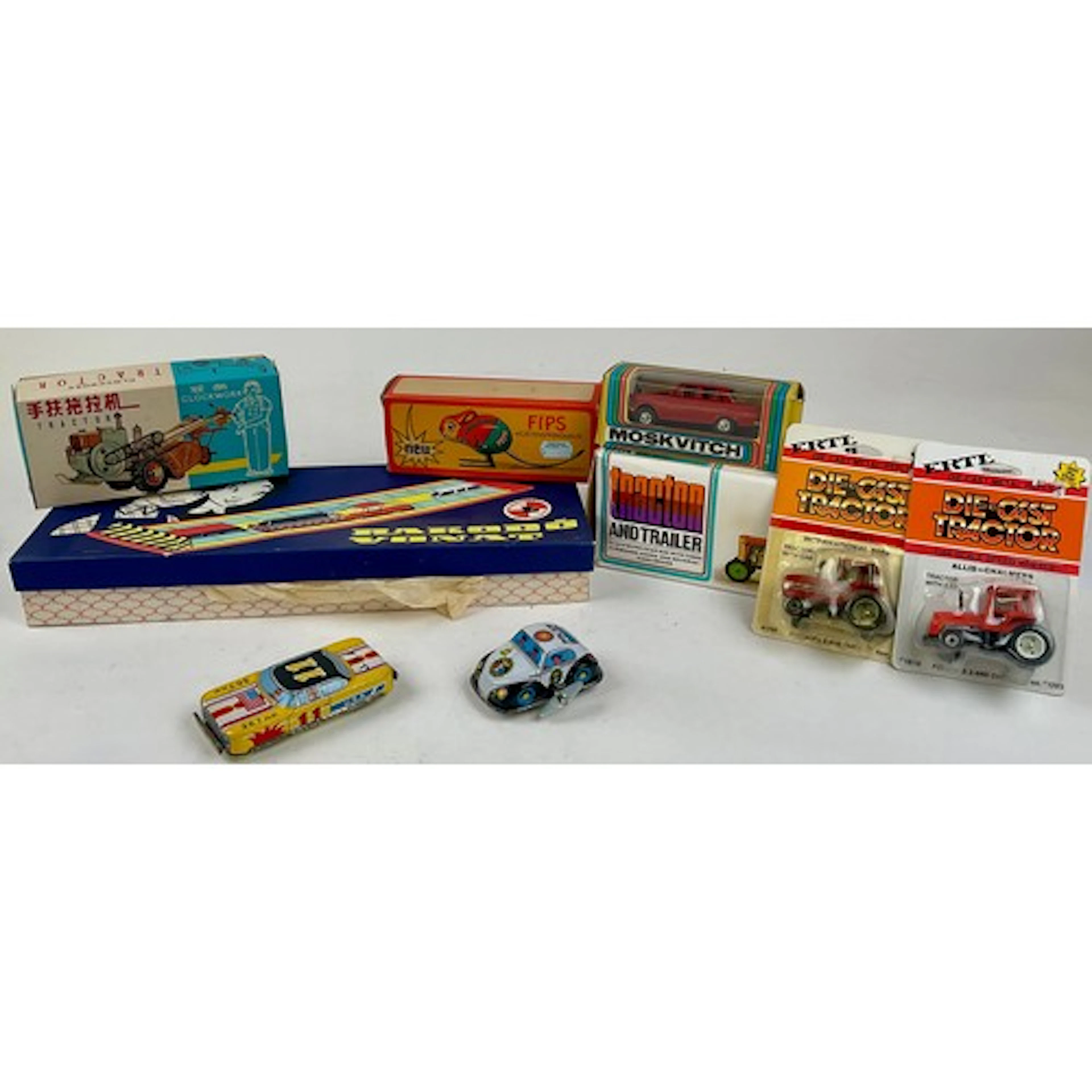 A Czechoslovakian clockwork tin plate toy tractor and traile...