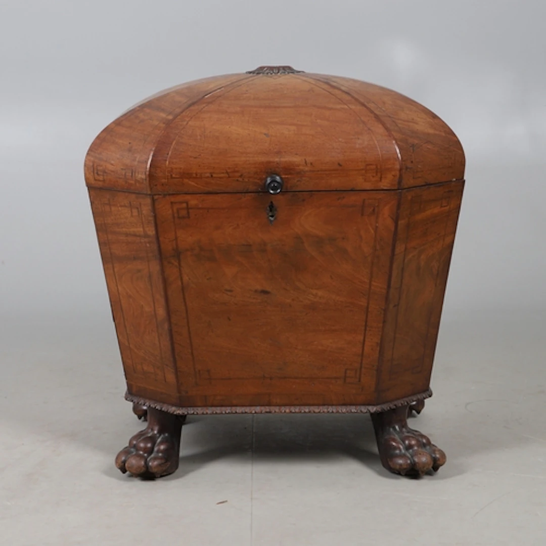 A GEORGE III MAHOGANY OCTAGONAL WINE CELLARETTE. with linear...