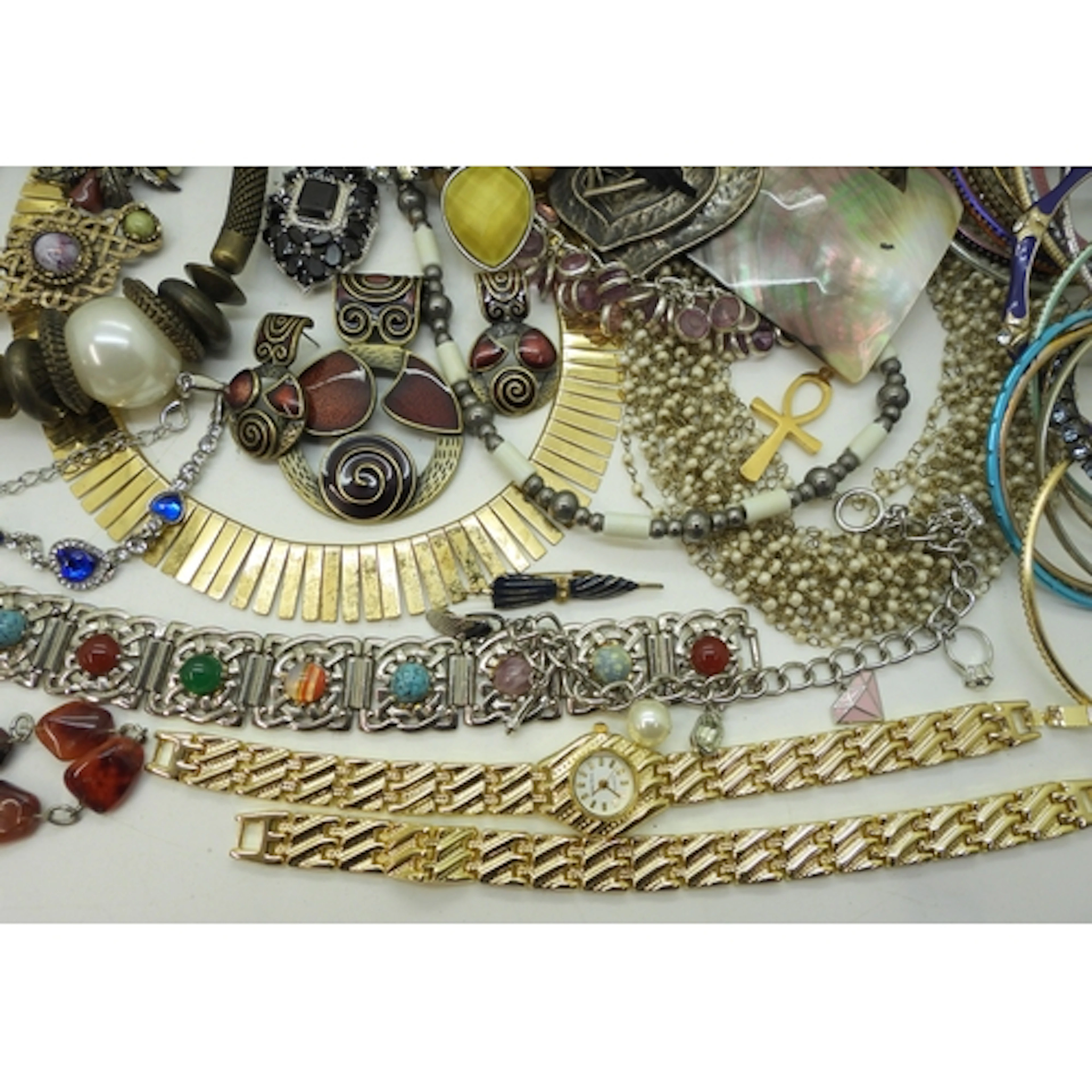 A large collection of costume jewellery bangles, a string of...