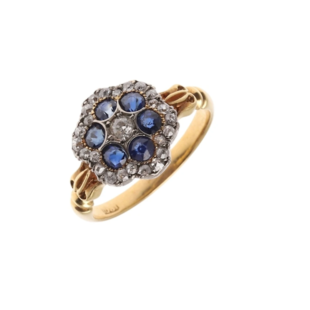 AN ANTIQUE SAPPHIRE AND DIAMOND CLUSTER RING. the six circul...