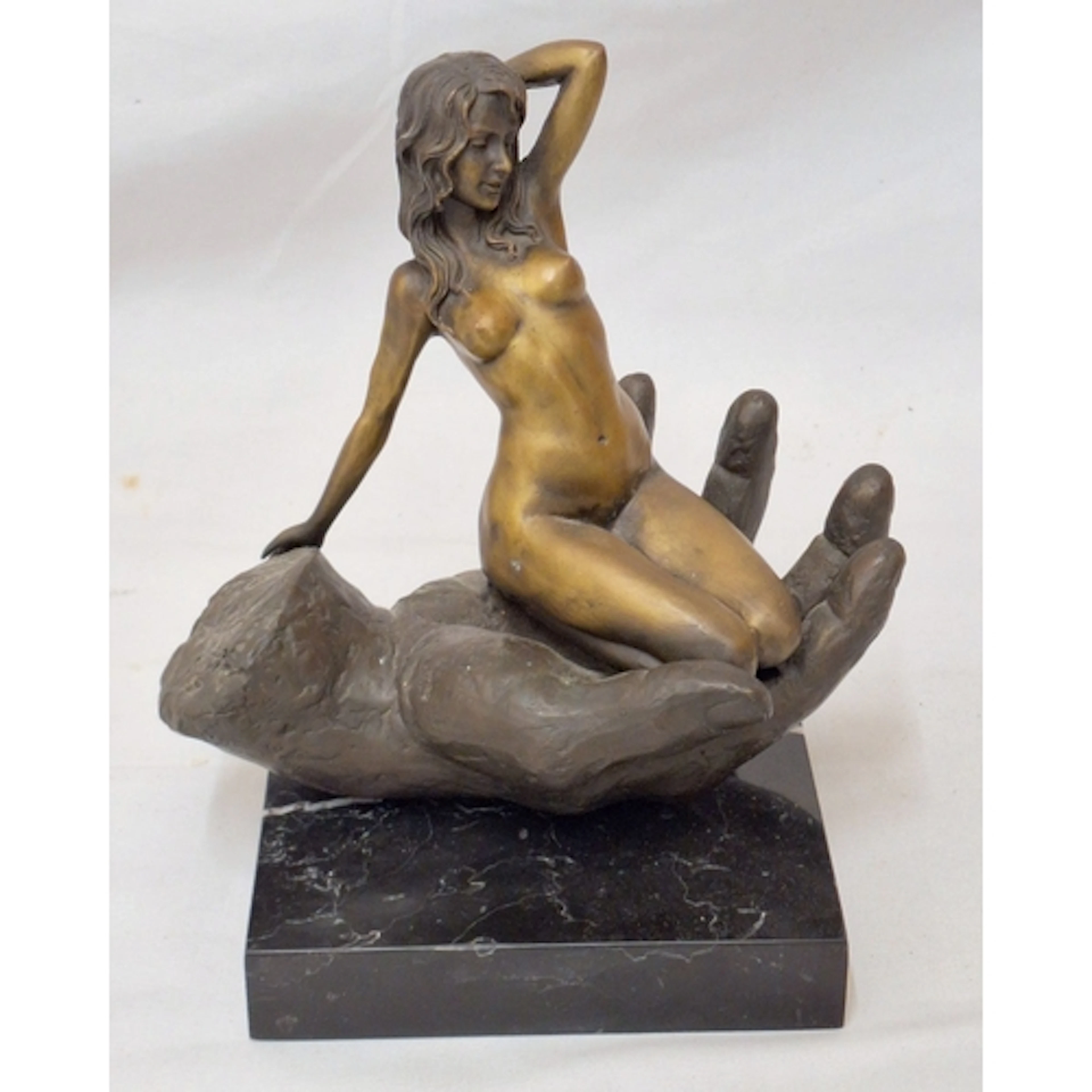 Bronze Sculpture Nude Female sitting in a hand, on black mar...