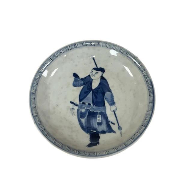 An 18th century Chinese blue and white dish decorated with a...