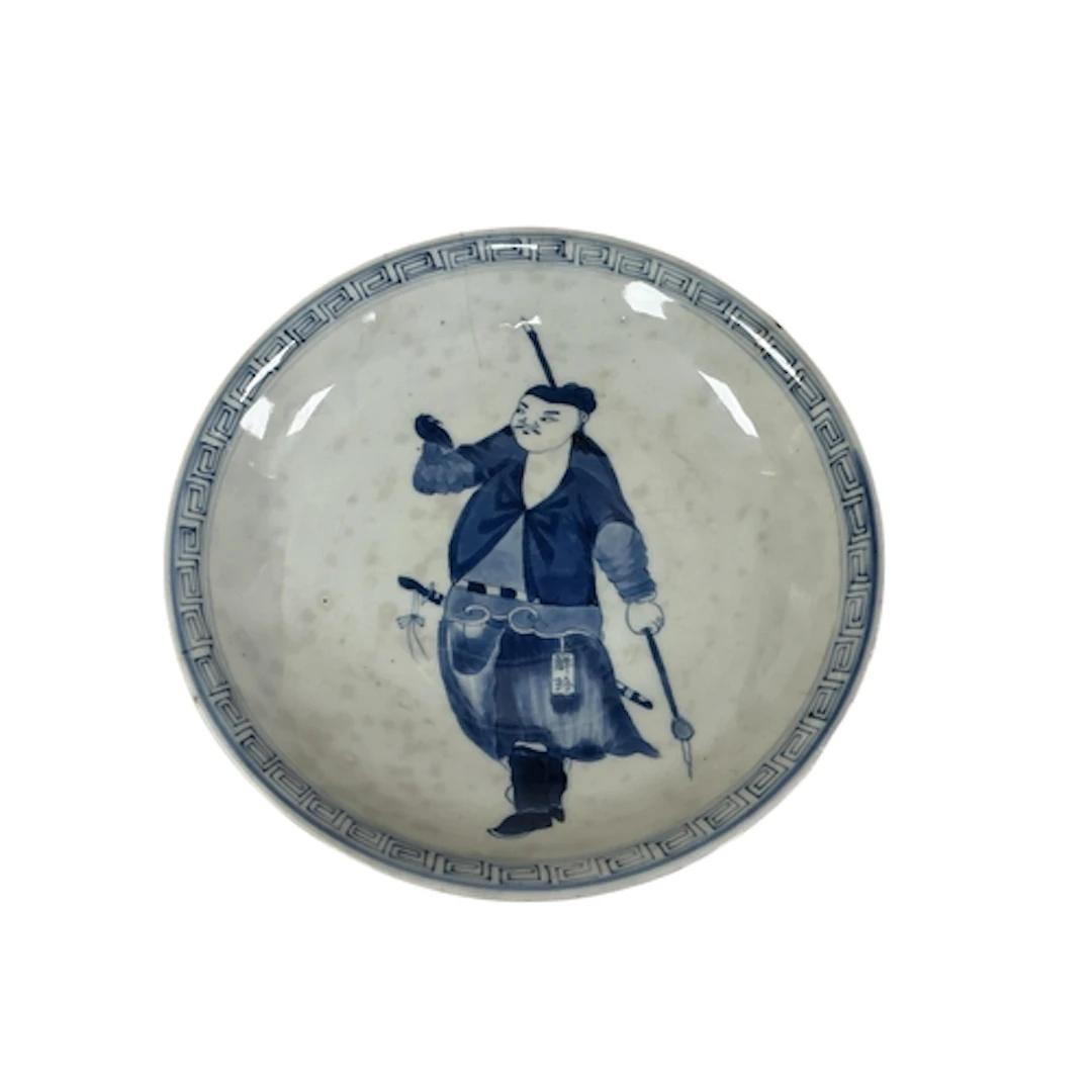 An 18th century Chinese blue and white dish decorated with a...