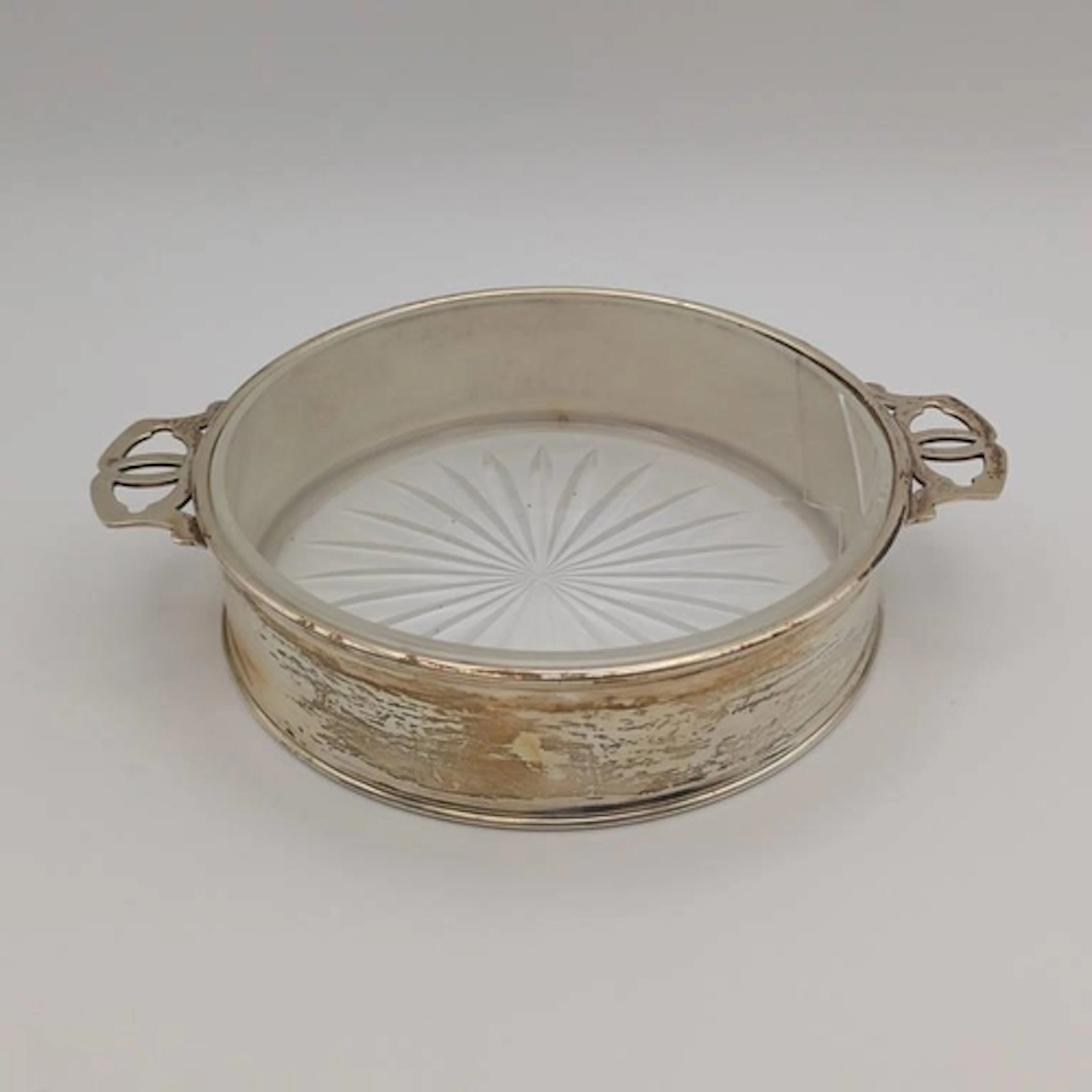 A SILVER 2-HANDLED CIRCULAR BUTTER DISH WITH GLASS LINER, GL...