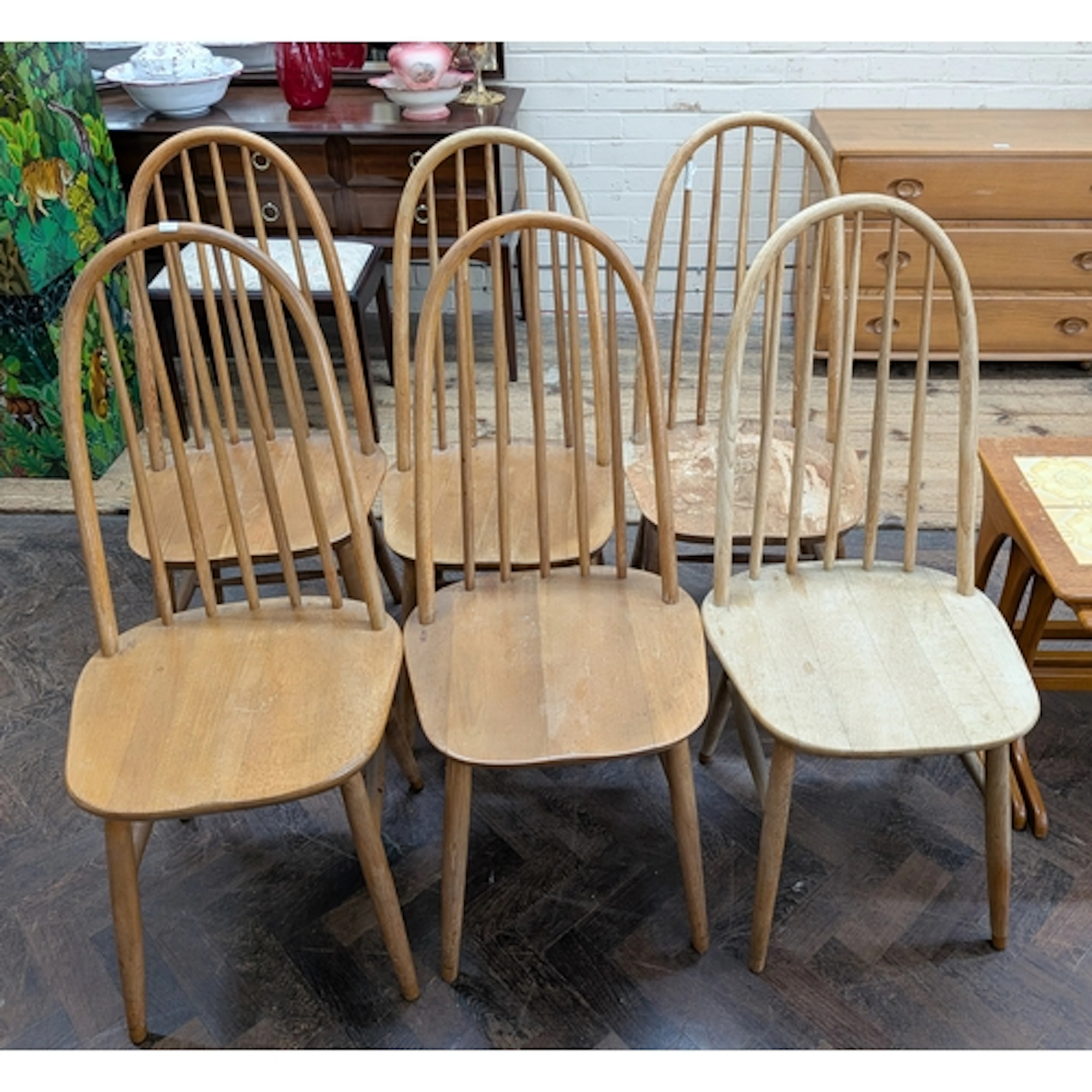 A set of six elm hoop spindle back dining chairs in the Erco...