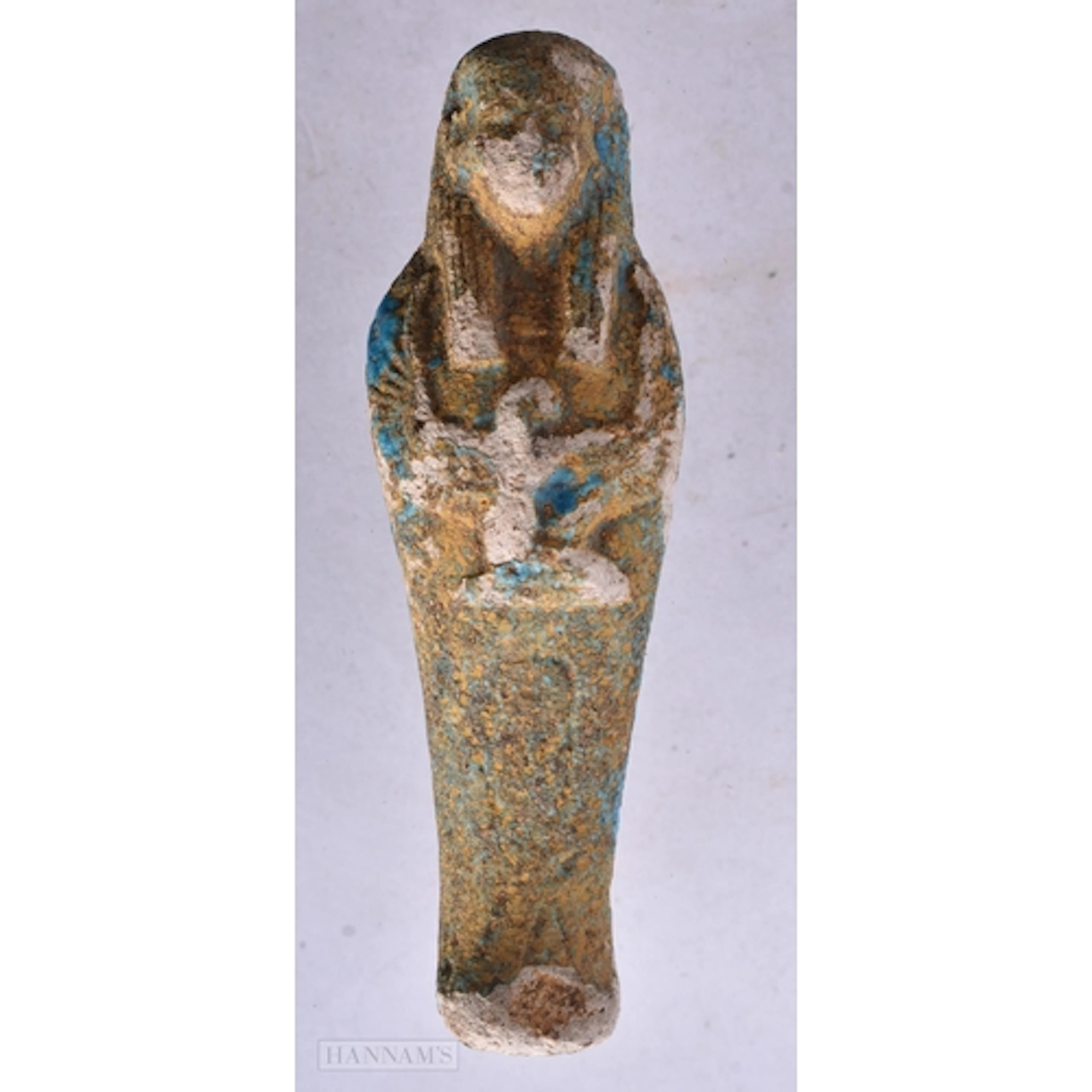 AN EGYPTIAN FAIENCE USHABTI. 9.5 cm high.