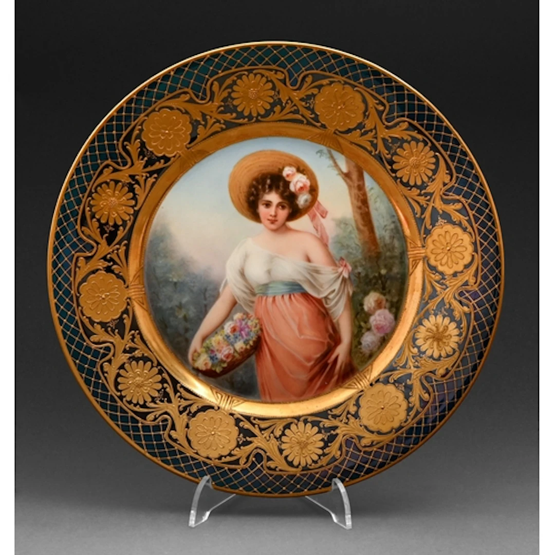 A Berlin porcelain Vienna-style plate, c1910, painted with a...