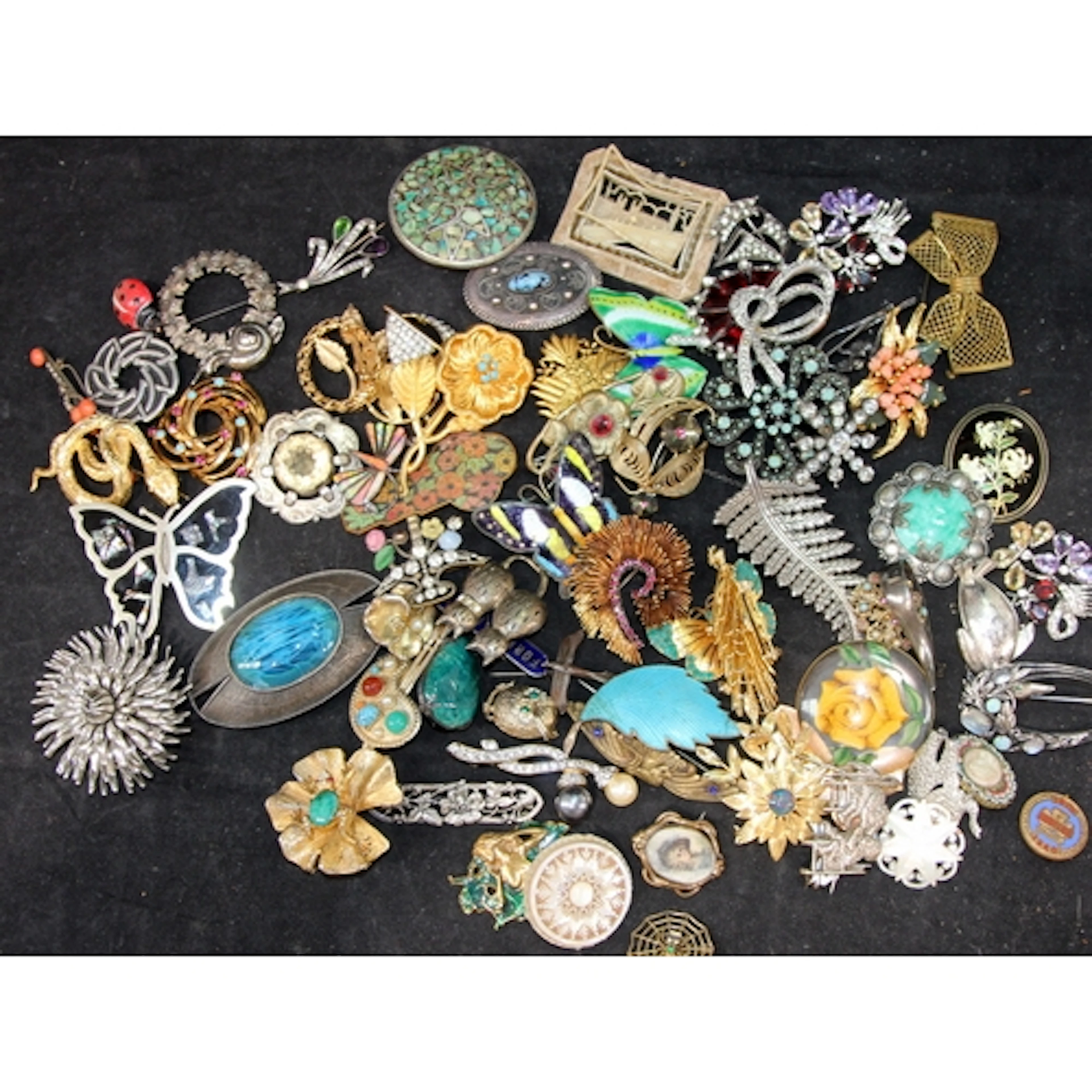 A collection of costume jewellery brooches, vintage and mode...