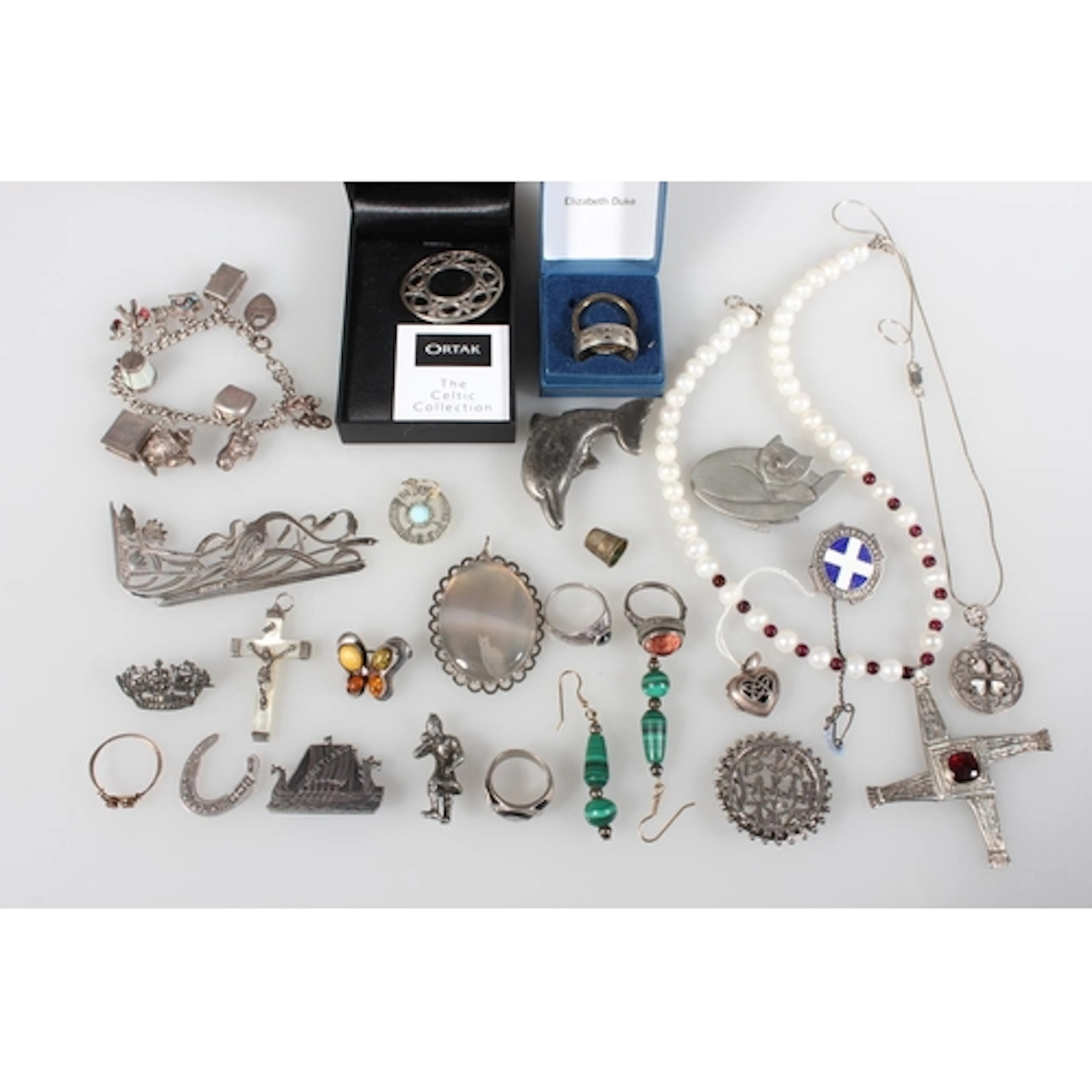 Ortak silver Celtic design brooch held in Ortak box, pewter ...