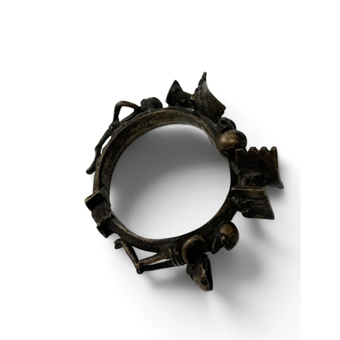 A TRIBAL AFRICAN BRASS BRACELET CAST WITH HUMAN FIGURES AND ...