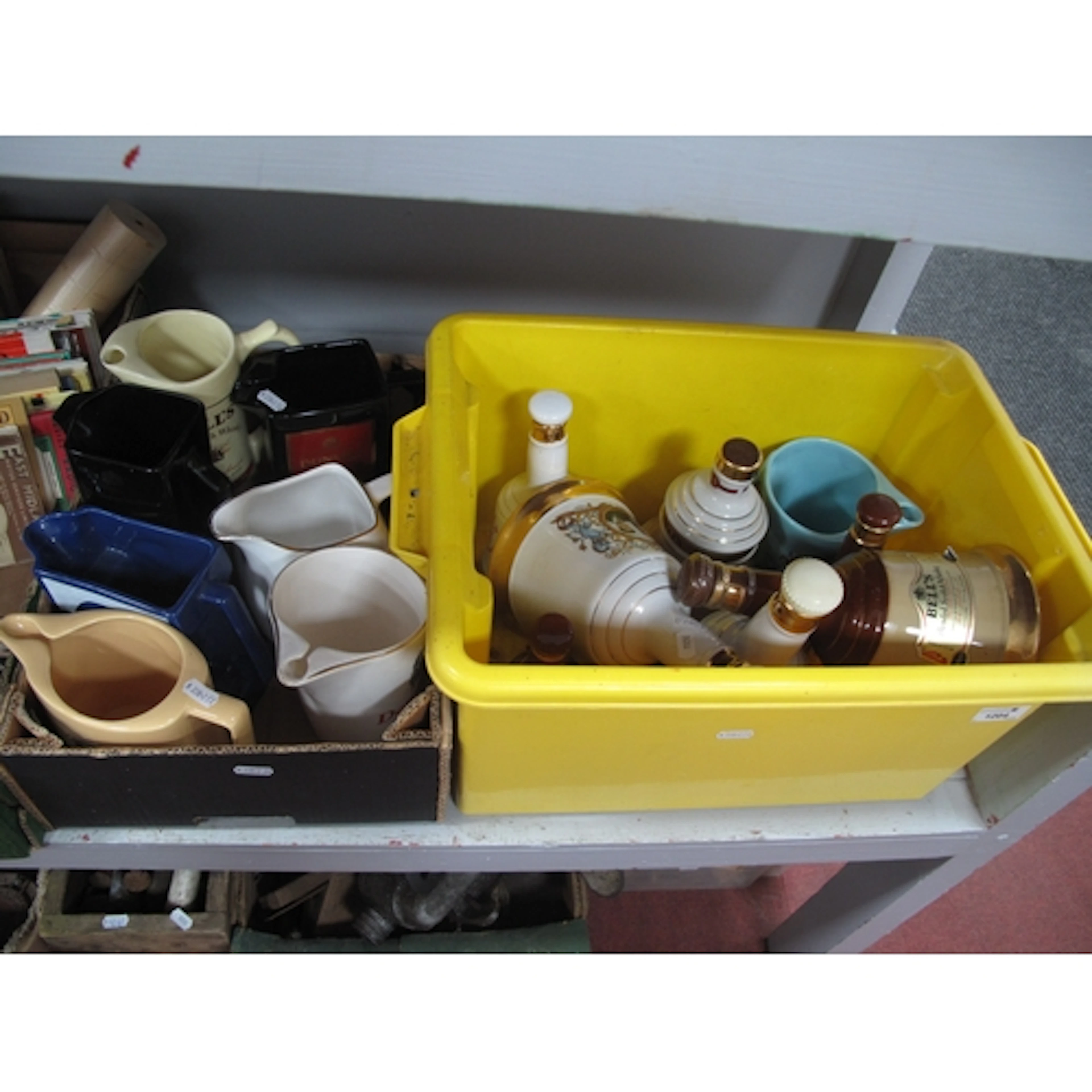 Ceramic decanters and jugs, including quantity of empty Bell...