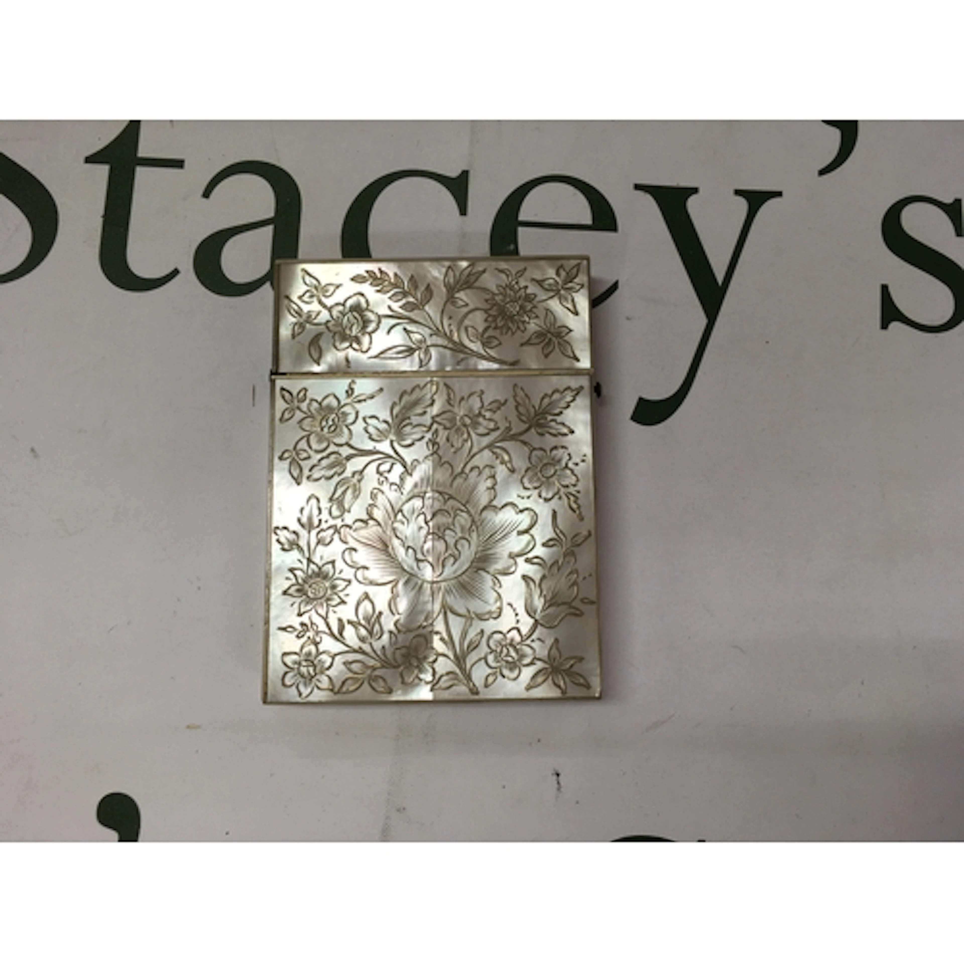 A Victorian era hand engraved mother of pearl calling card c...