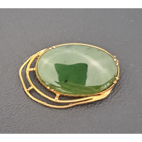 JADE COLOURED HARDSTONE BROOCH in nine carat gold mount, app...