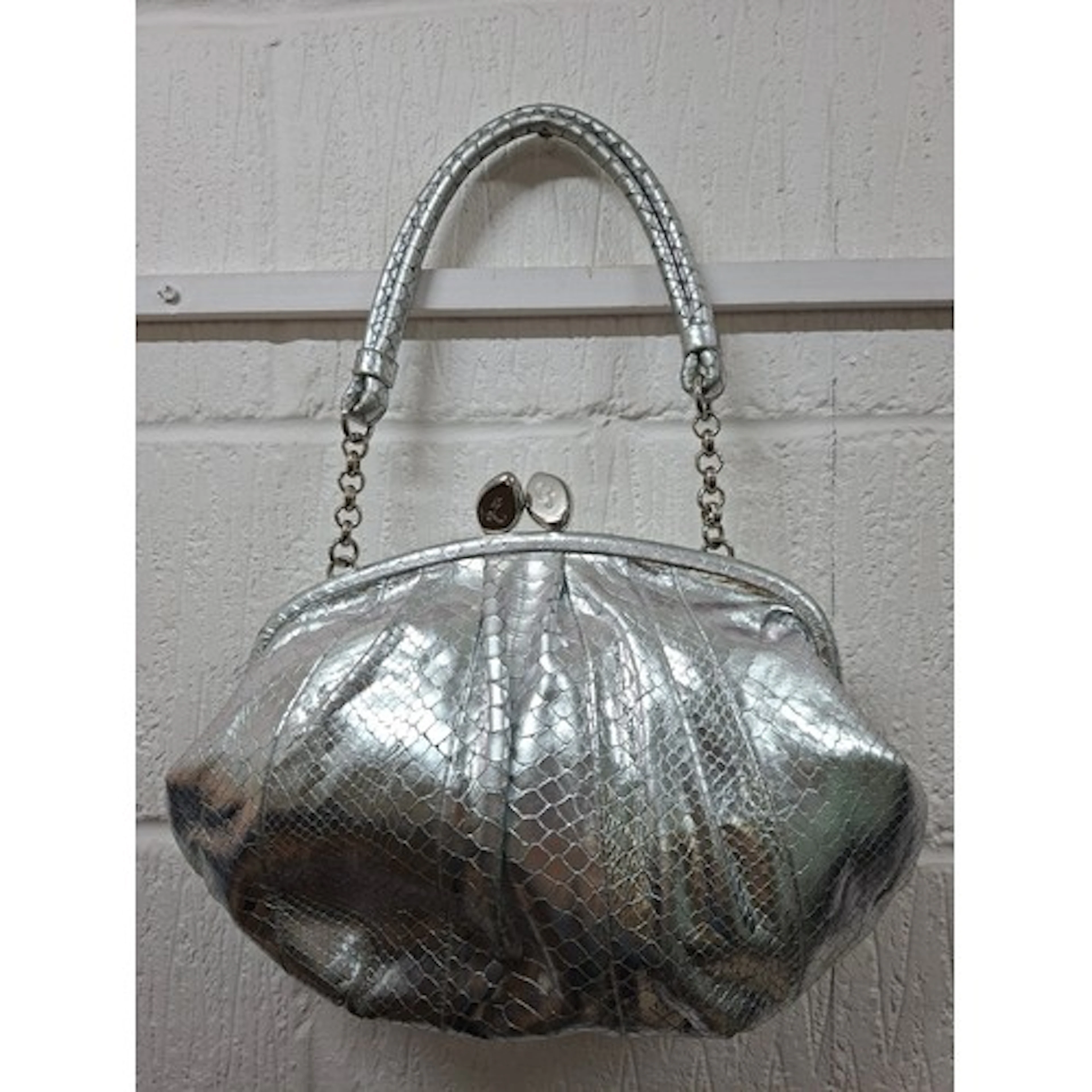 Lulu Guinness- A silver metallic leather and snakeskin effec...