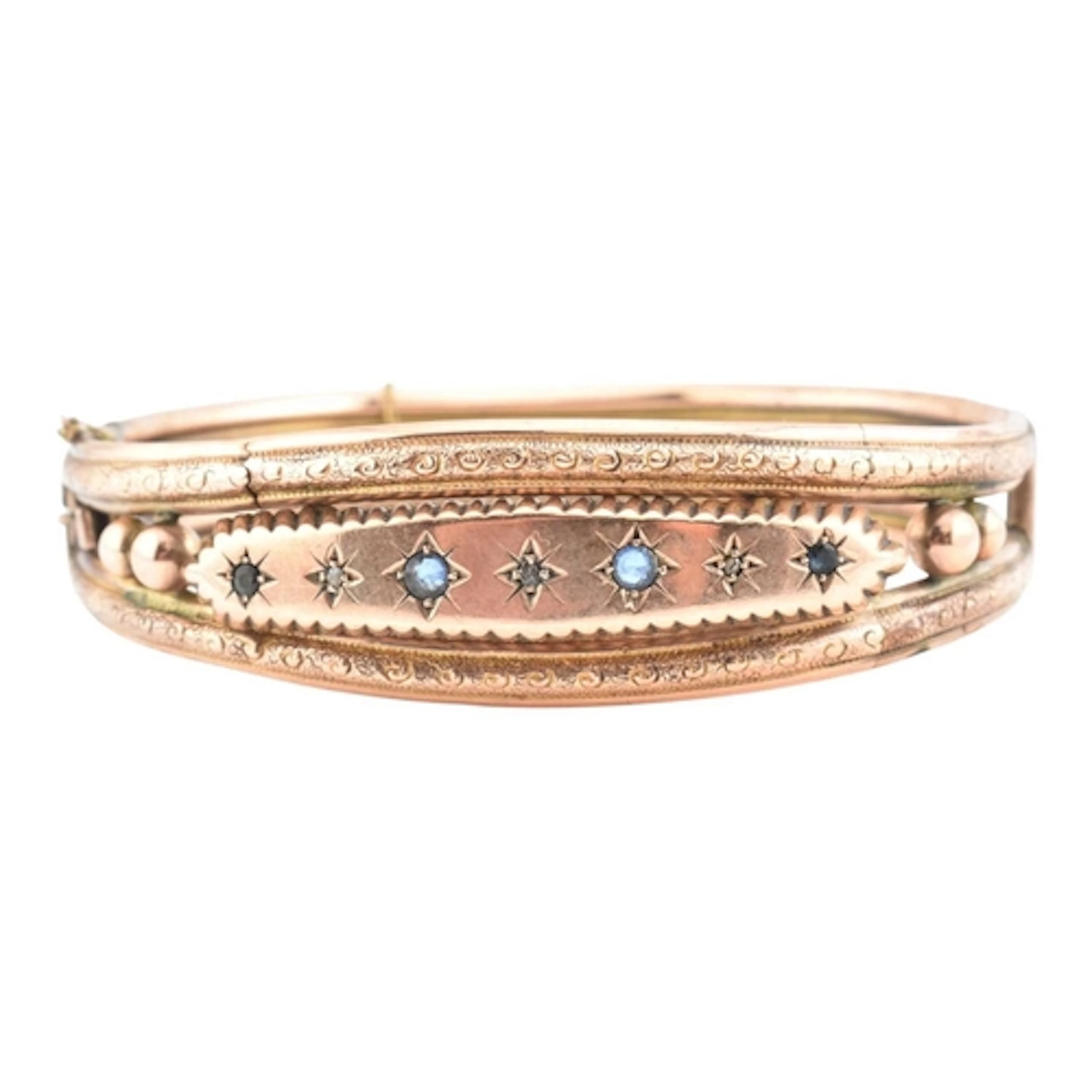 A Victorian 9ct gold paste and diamond bangle. The bangle se...