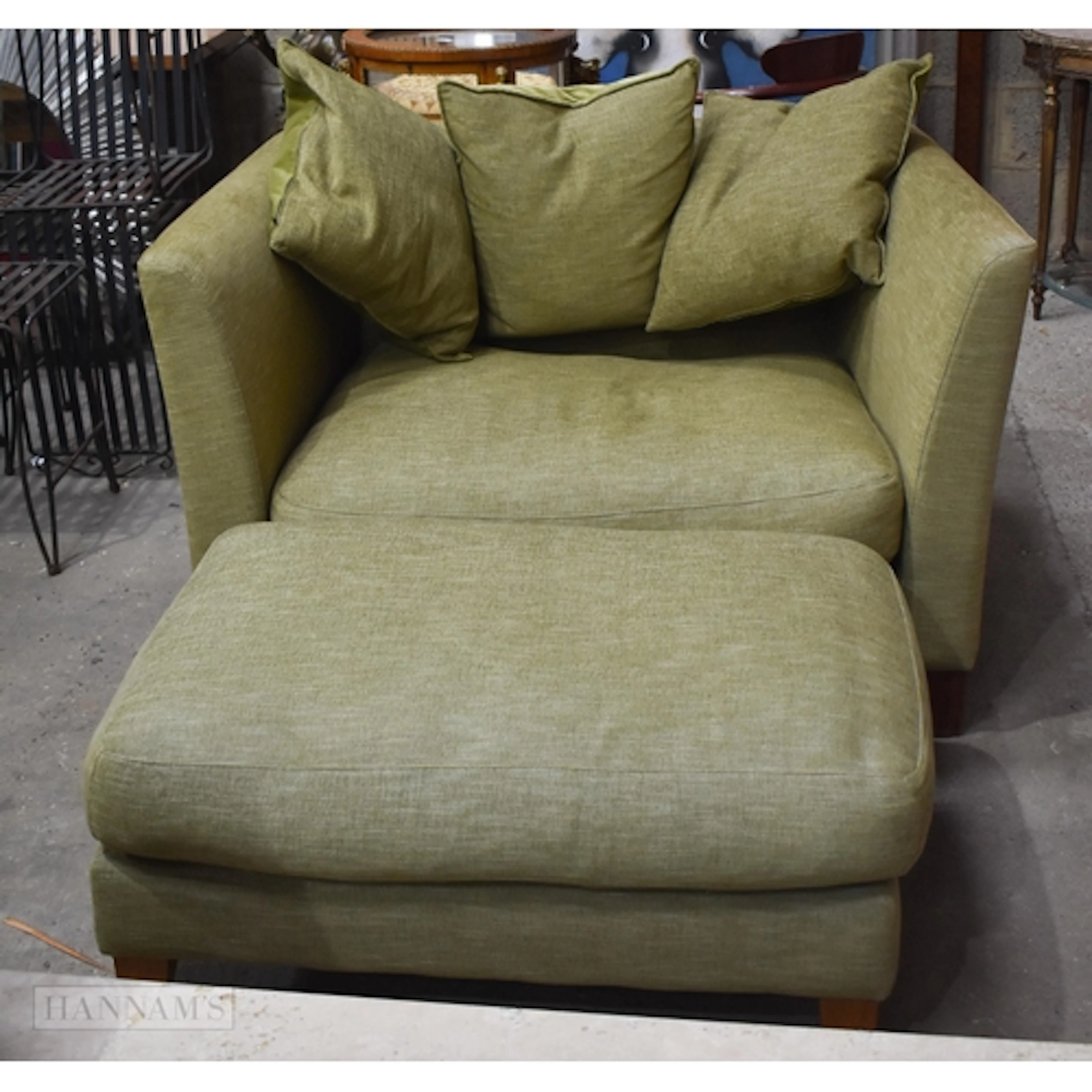 An upholstered Loveseat and matching footstool by john lewi...