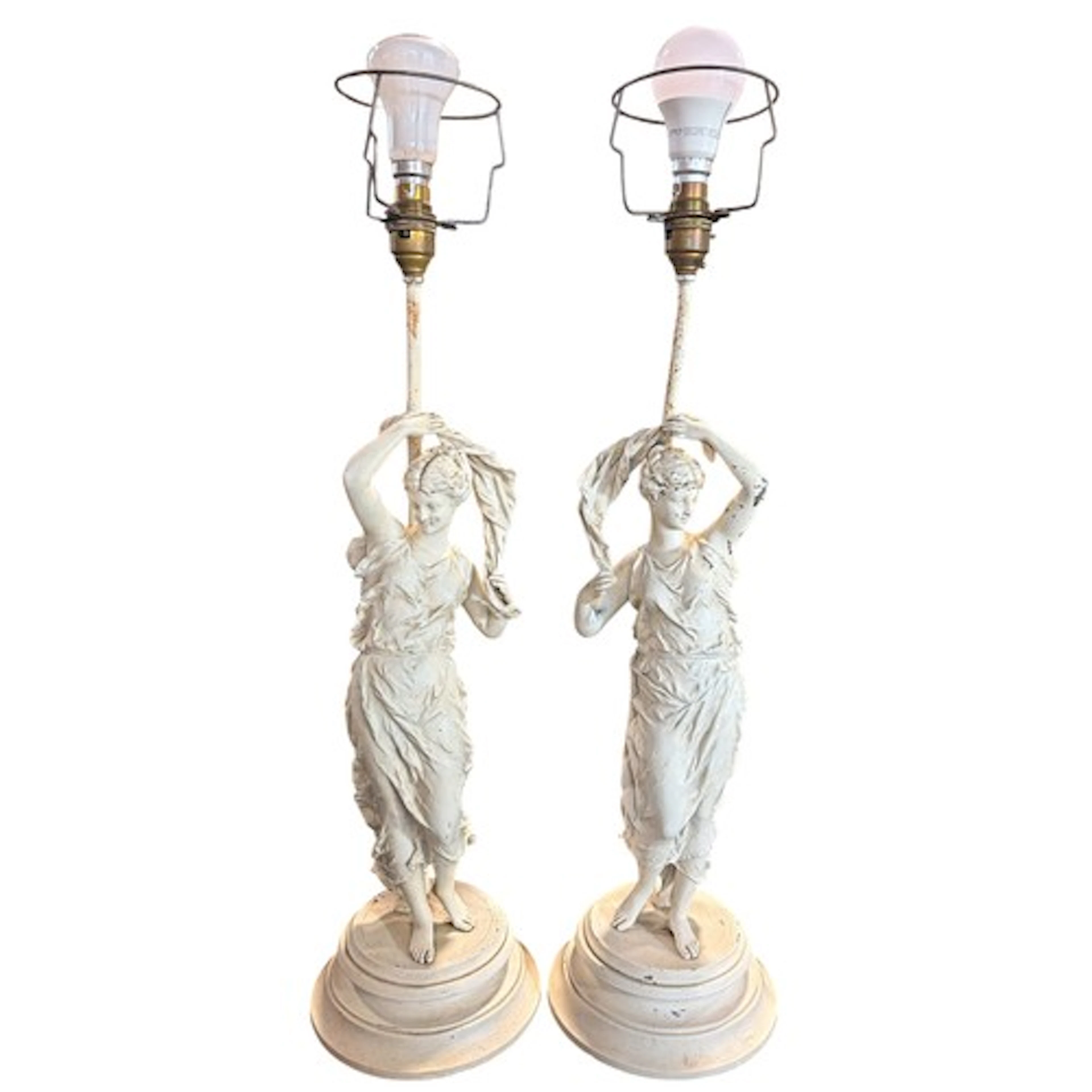 A pair of painted spelter converted figural table lamps with...