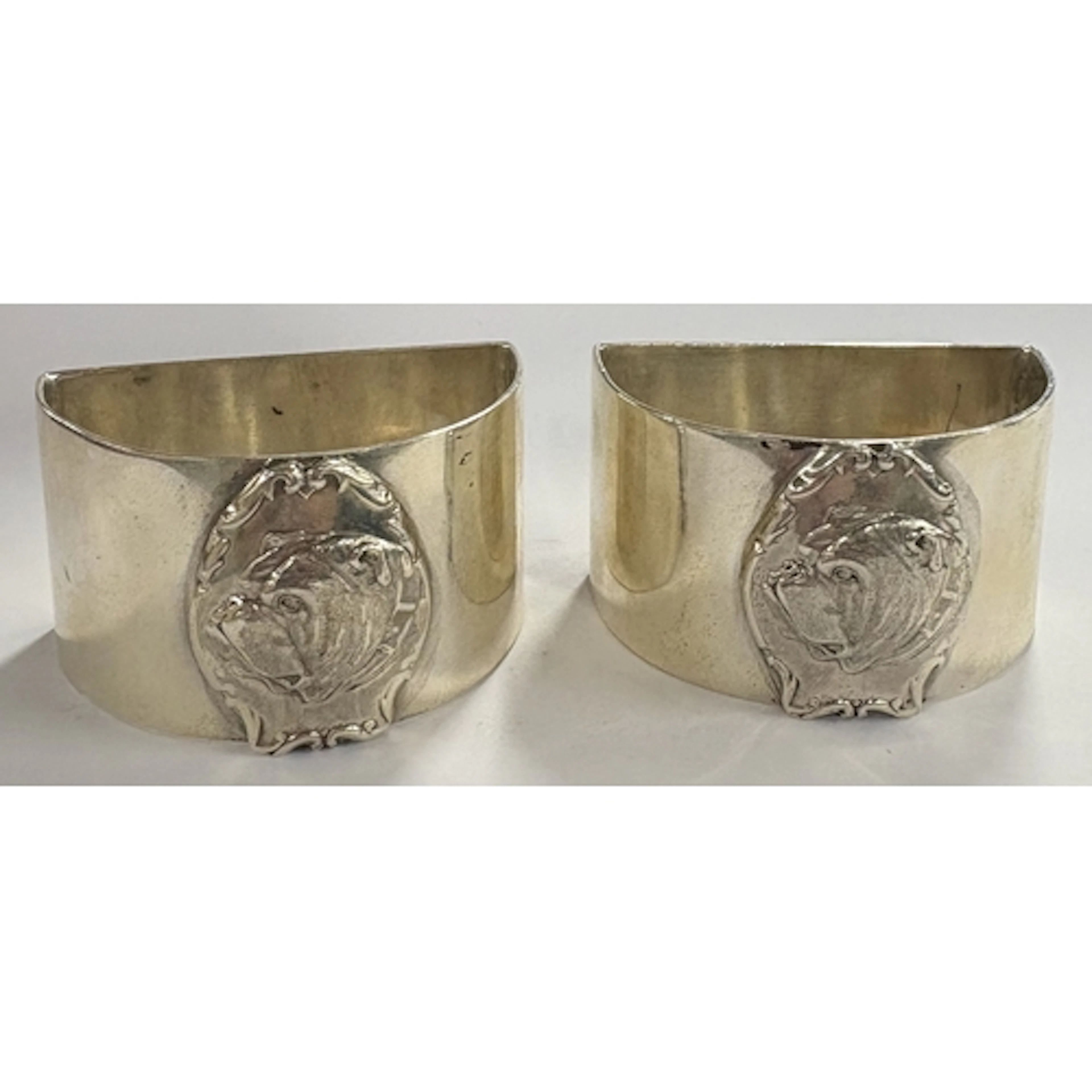 A novelty pair of silver napkin rings depicting British bull...