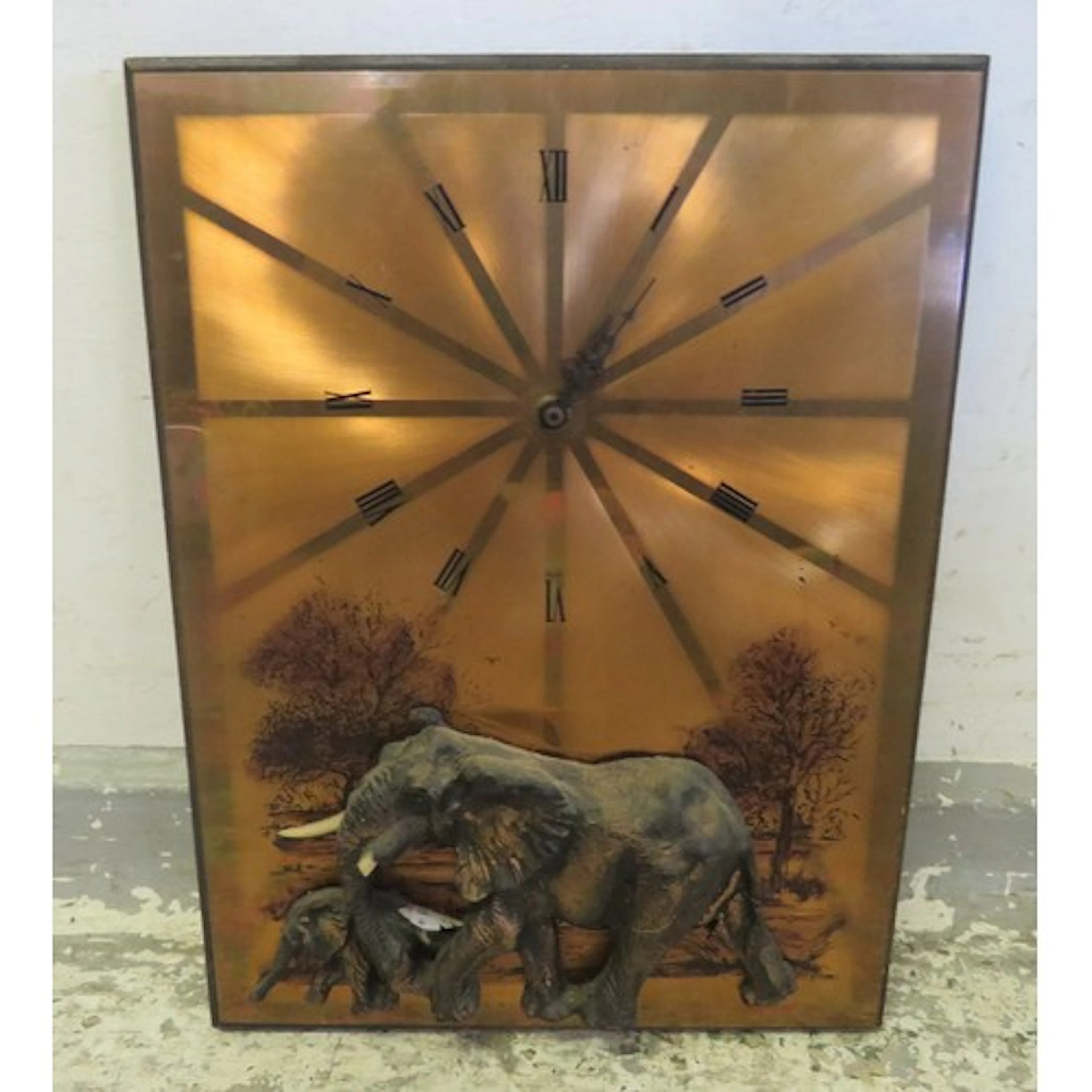Copper Backed Wall Clock with roman numerals with elephant d...