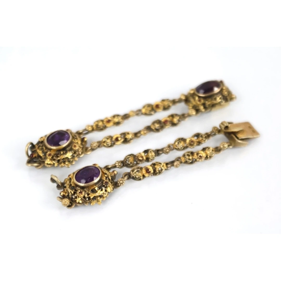An amethyst, enamel and silver gilt bracelet fragment, desig...