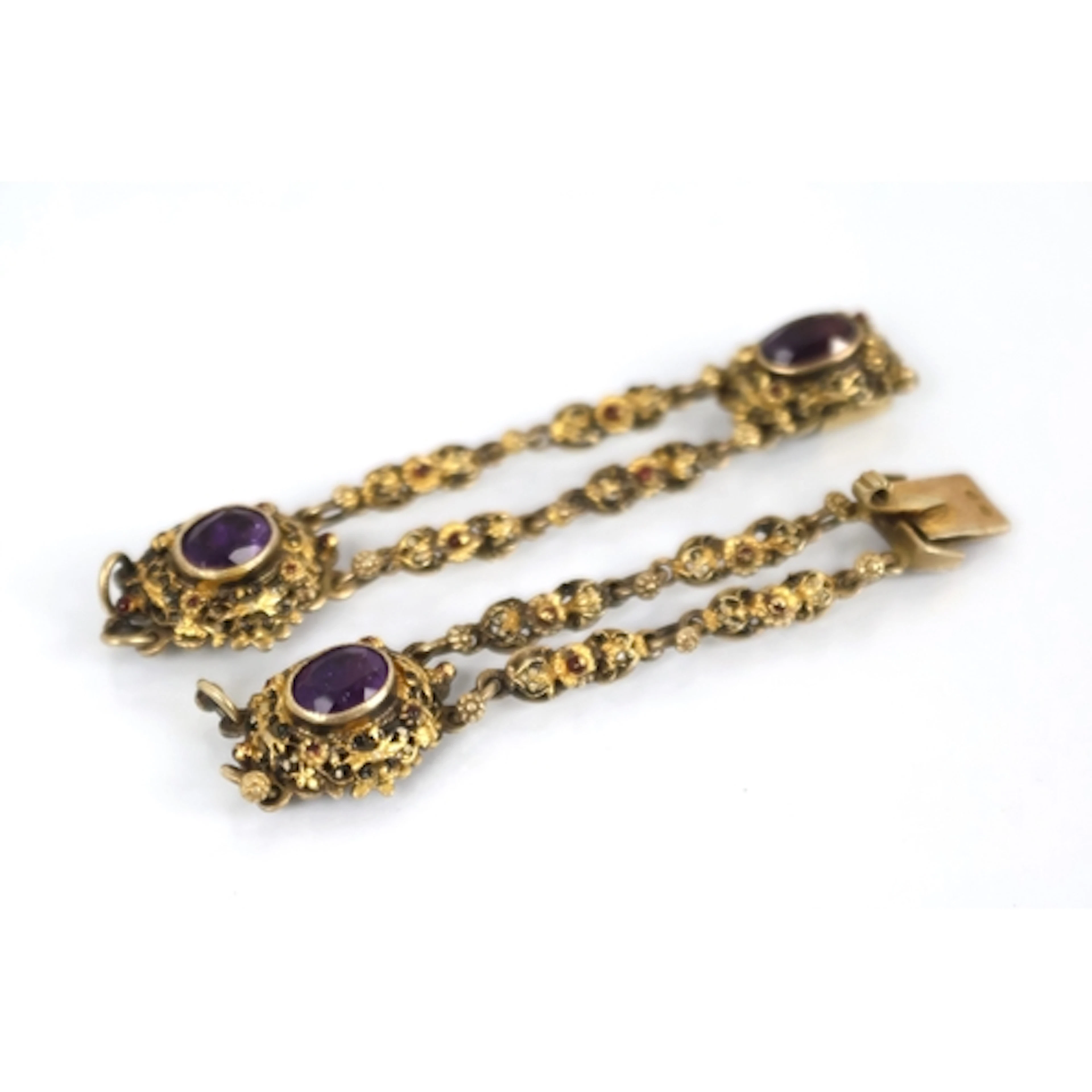 An amethyst, enamel and silver gilt bracelet fragment, desig...