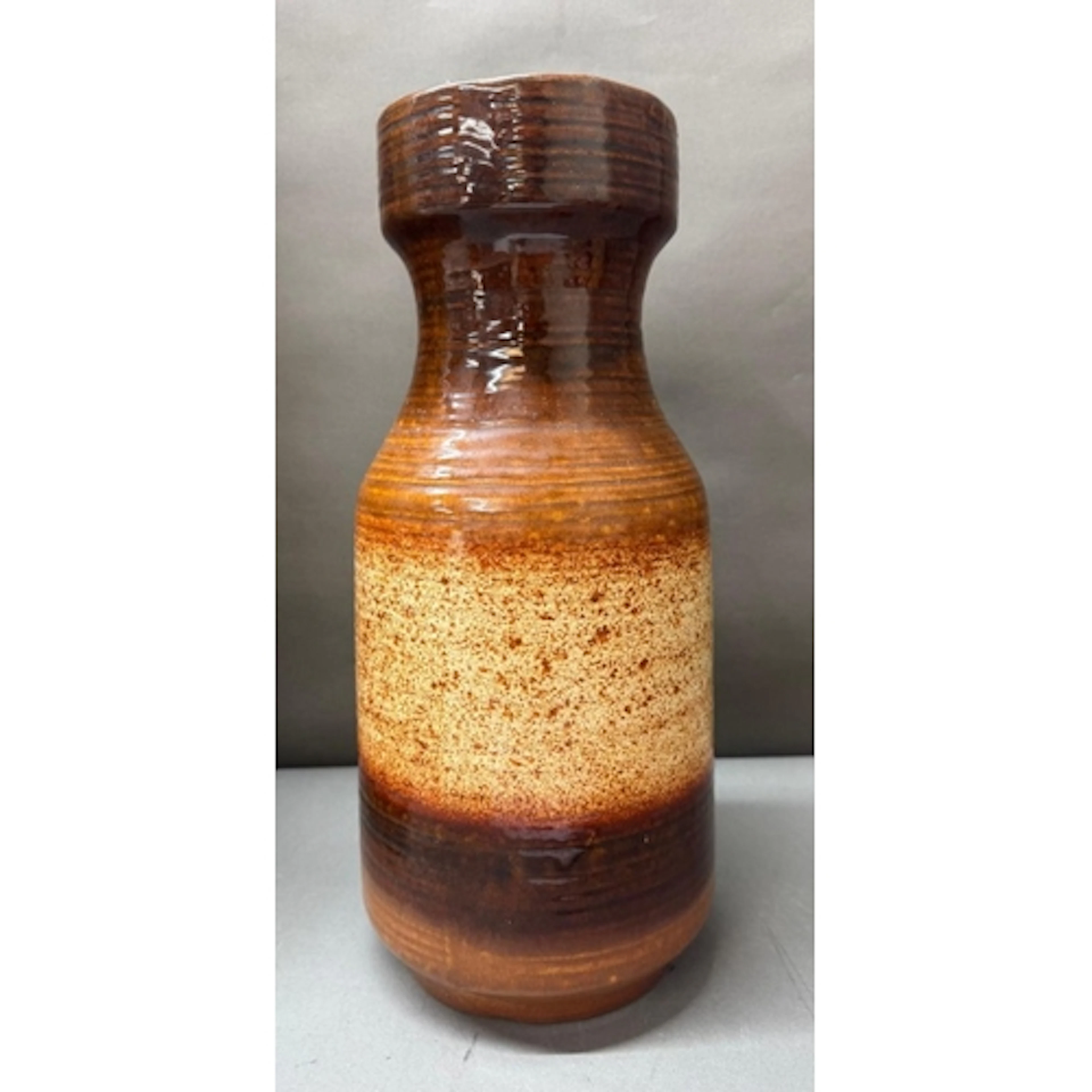 A mid-century Austrian two tone ceramic vase in bown and bei...