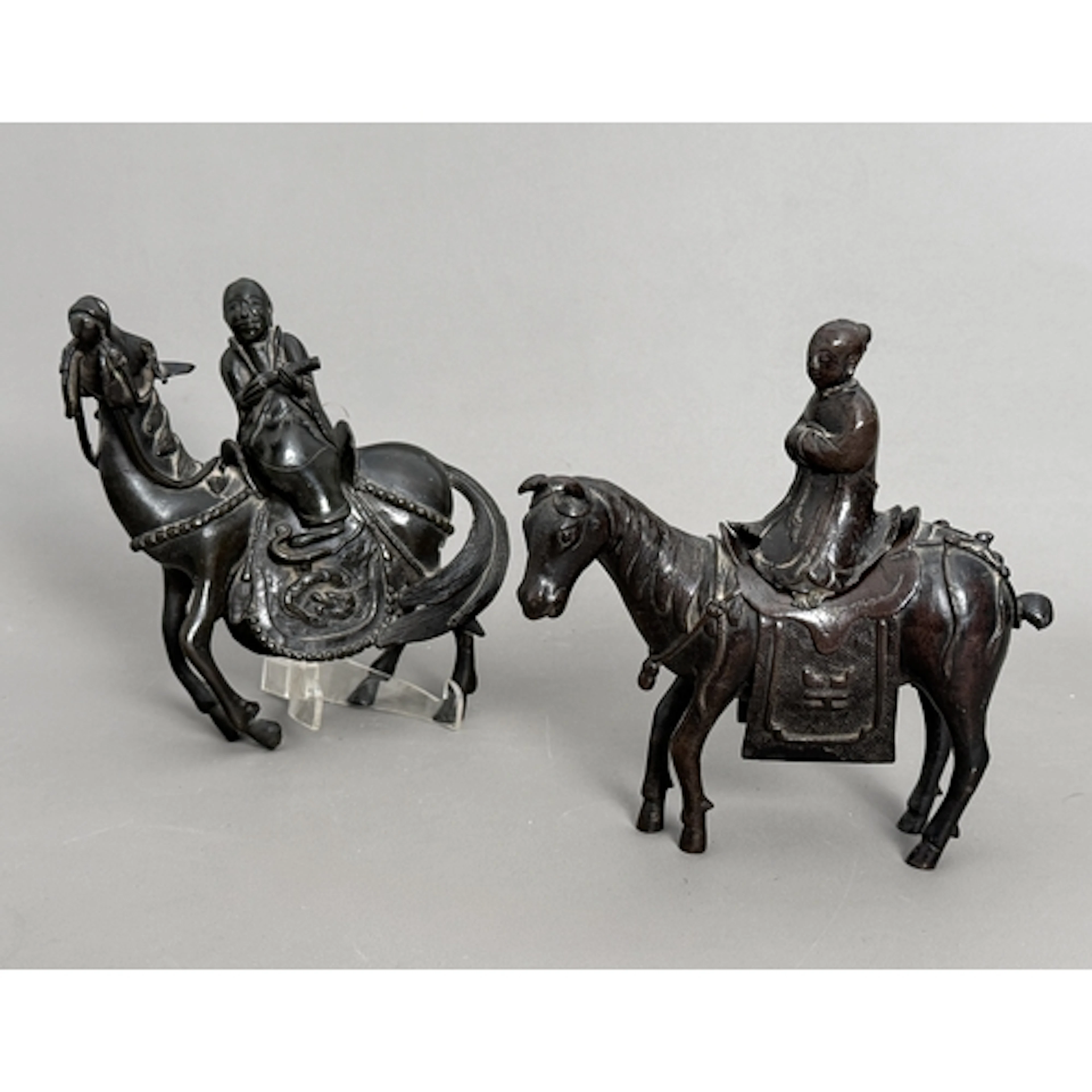 Two cast bronze Chinese censers - in the form of horses ridd...