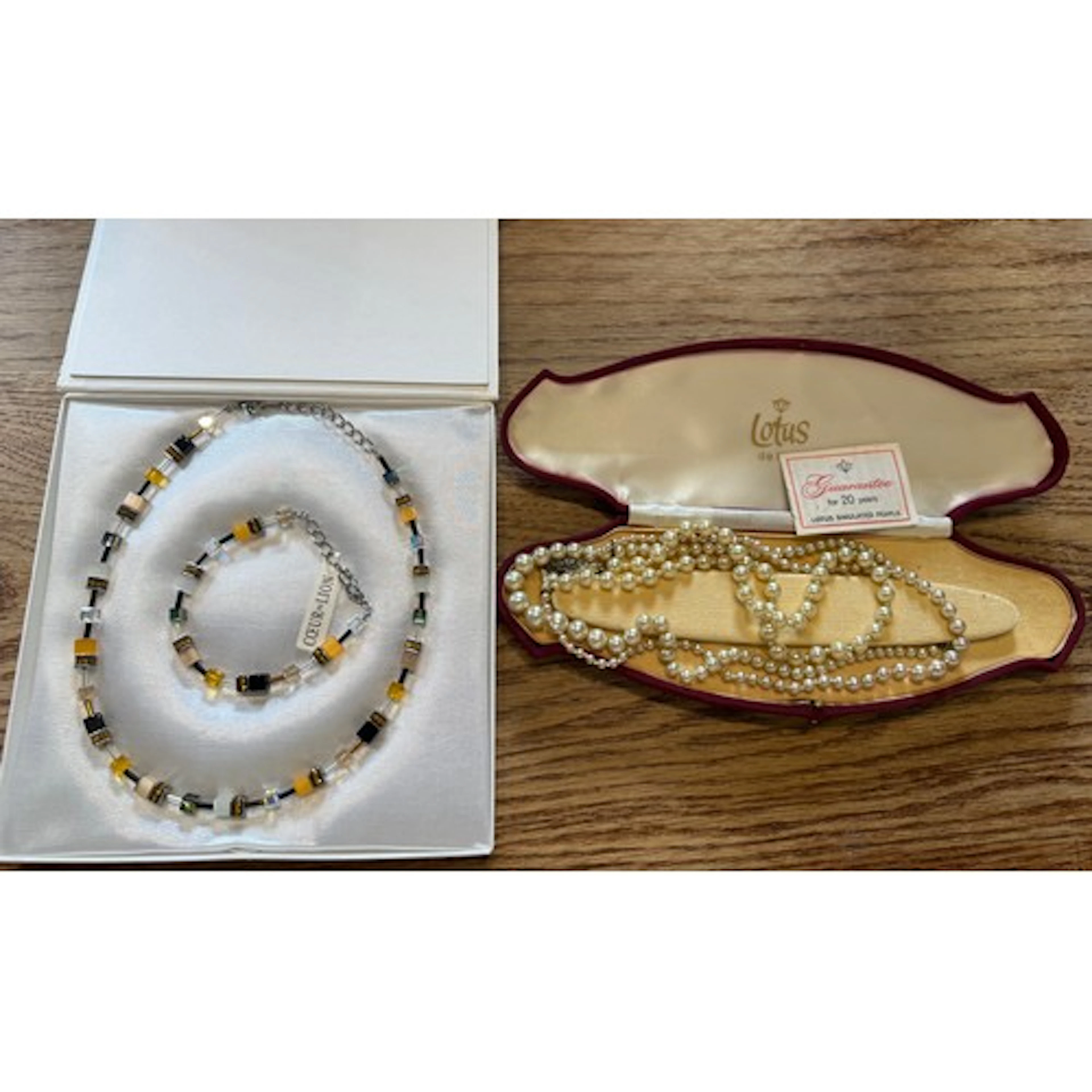 A vintage jewellery box and contents to include bracelets, w...