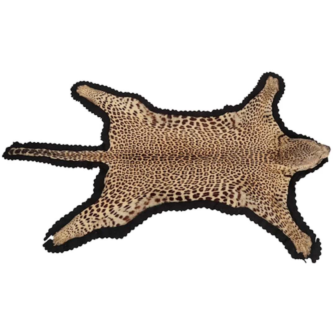 A taxidermy leopard (Panthera pardus) skin rug, early 20th c...