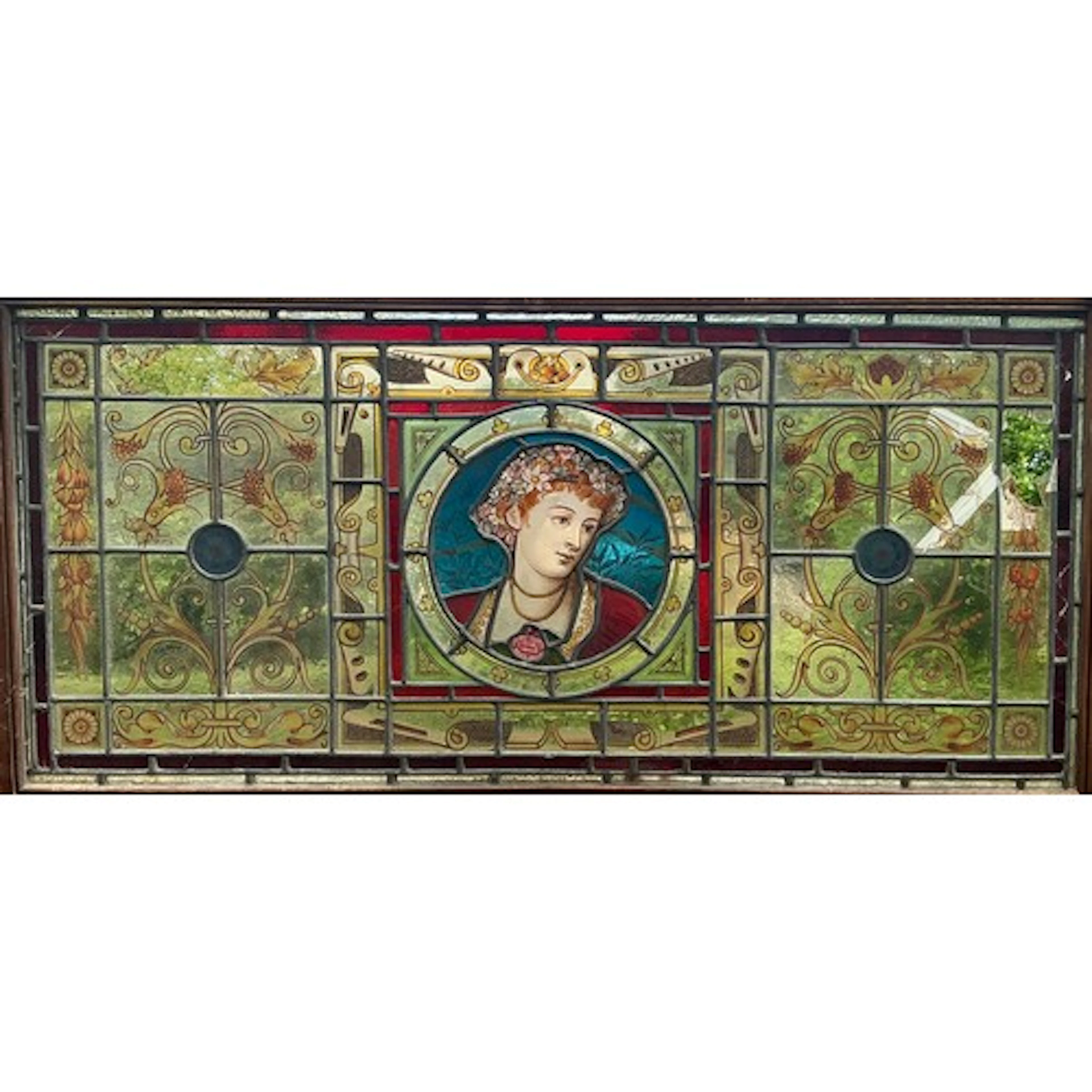 An Arts and Crafts stained glass panel, the central circular...
