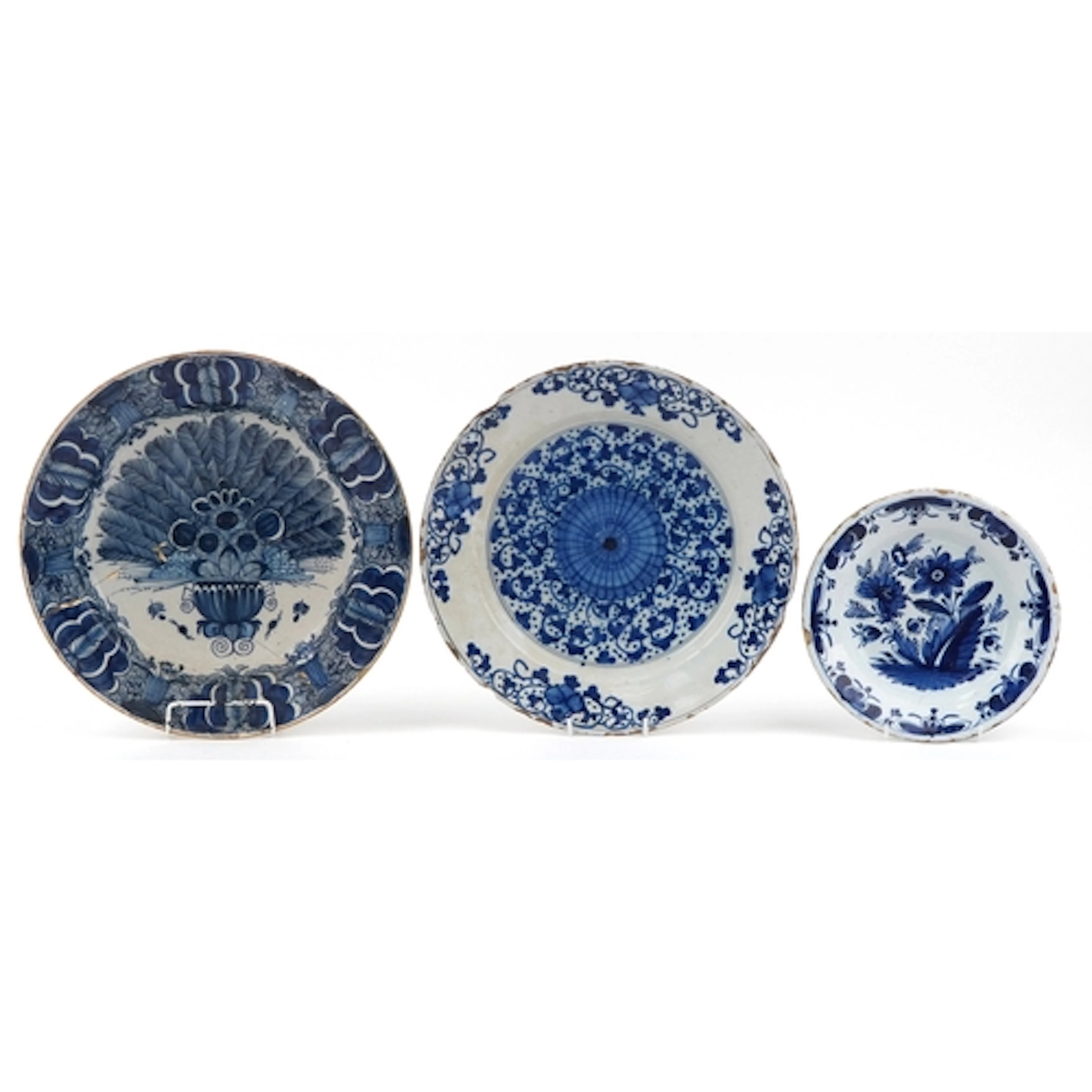 Three 18th century Dutch Delft blue and white tin glazed sha...