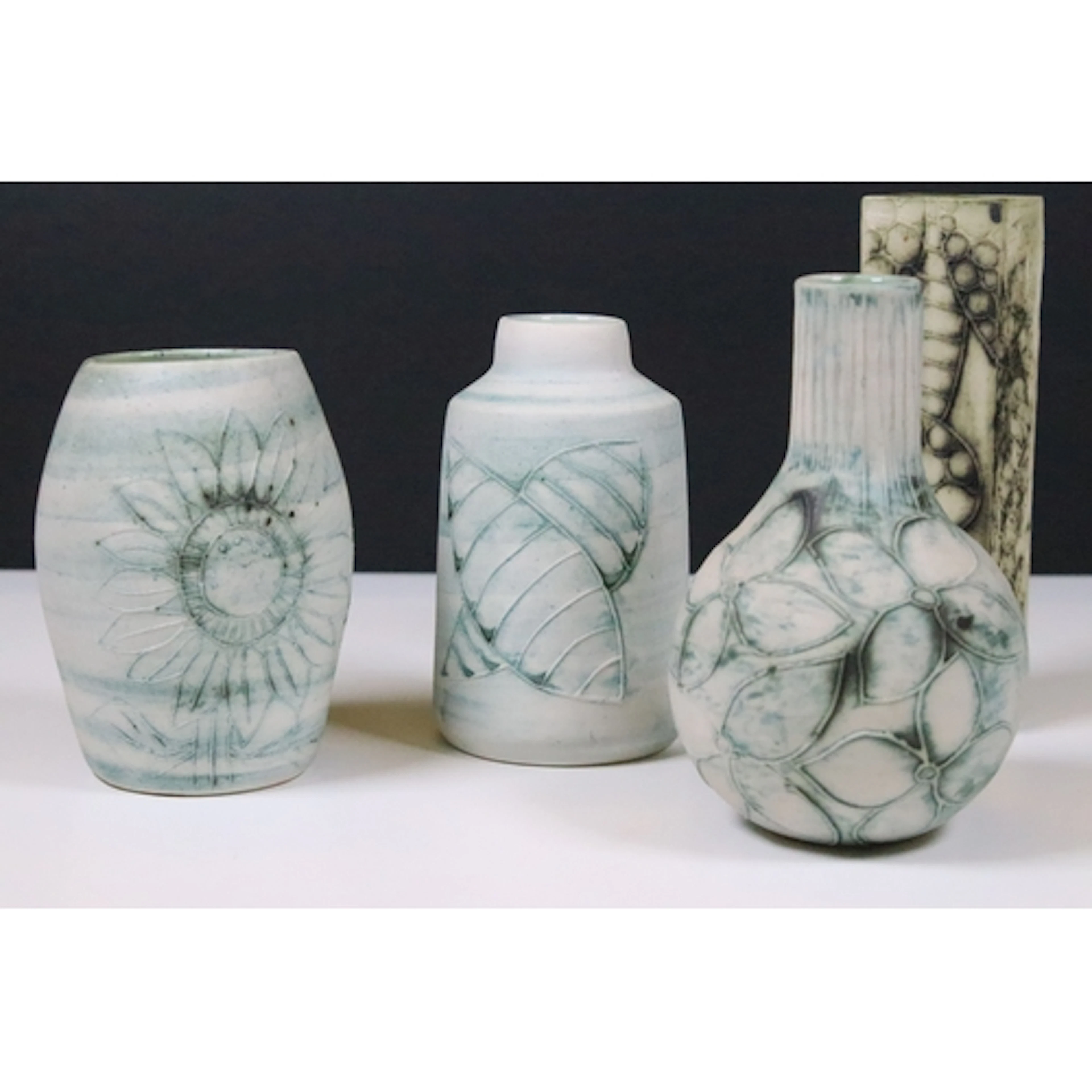 Four Carn of Cornwall pottery vases designed by John Beusman...