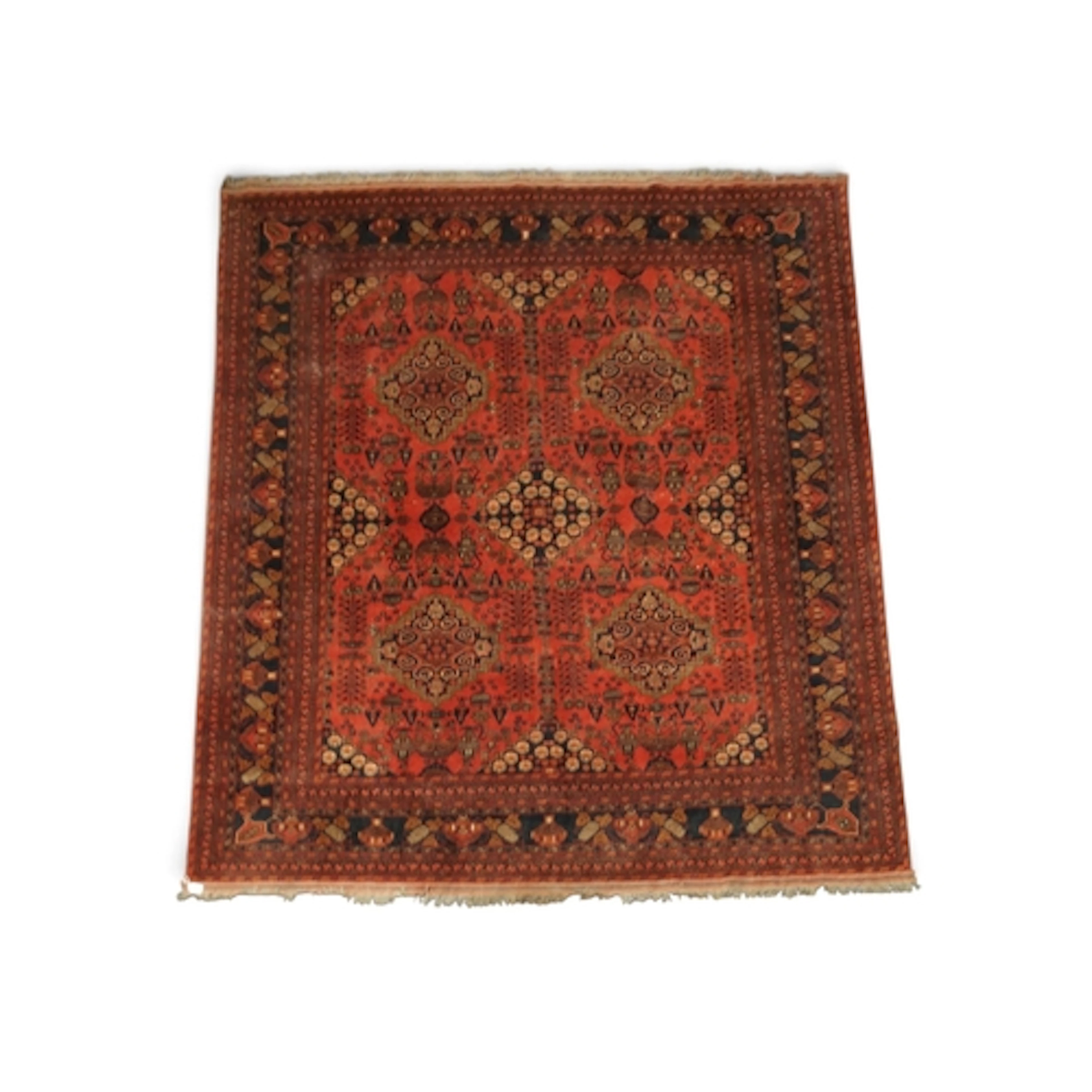 A RED GROUND KHAL MOHAMMADI RUG with five dark blue geometri...