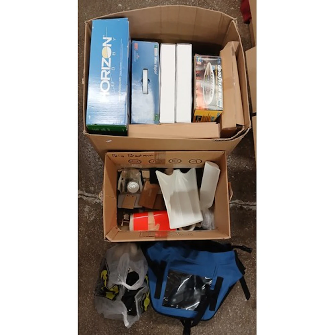 Box of assorted boxed model planes.
