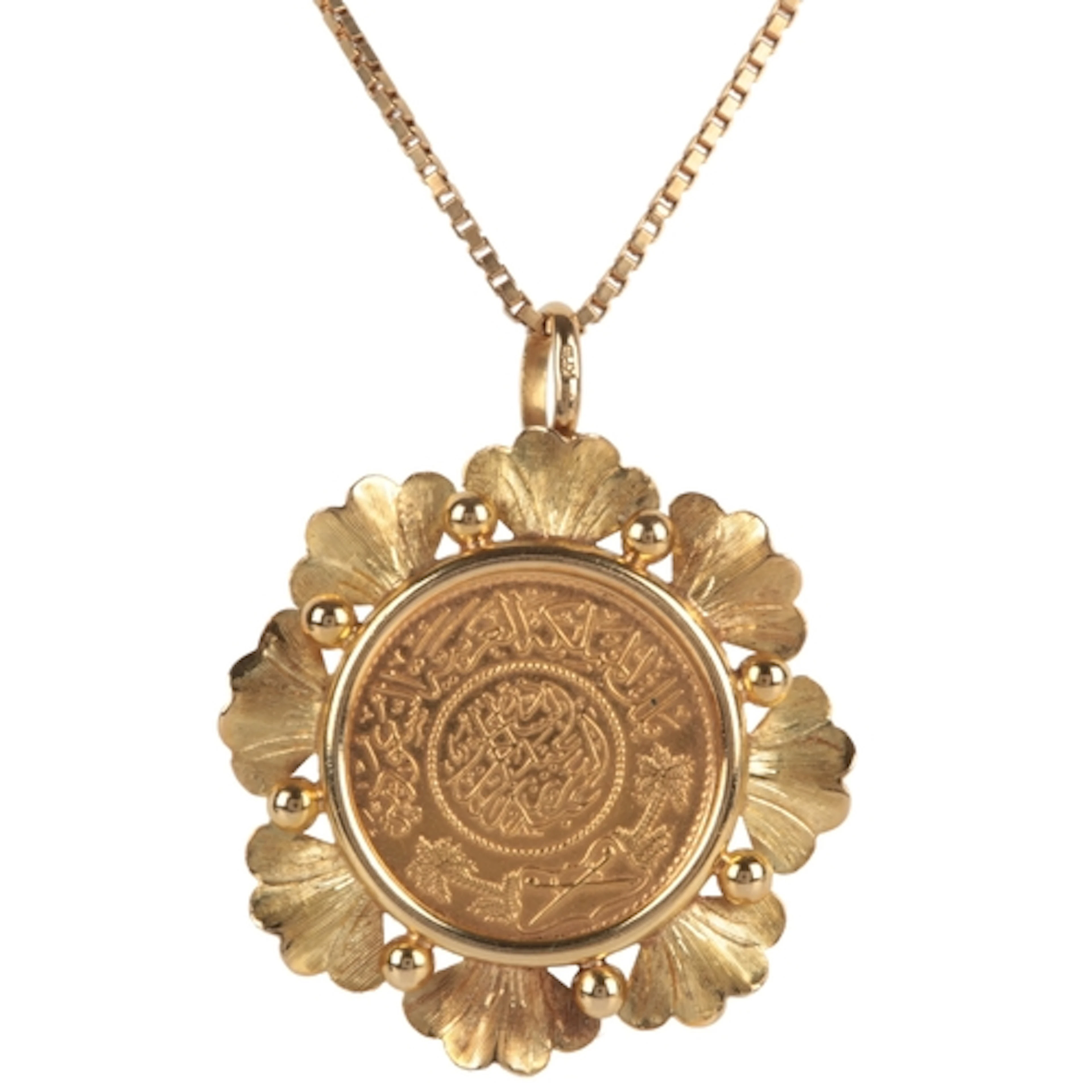 A gold coin necklace, set with a gold Saudi guinea coin, wit...