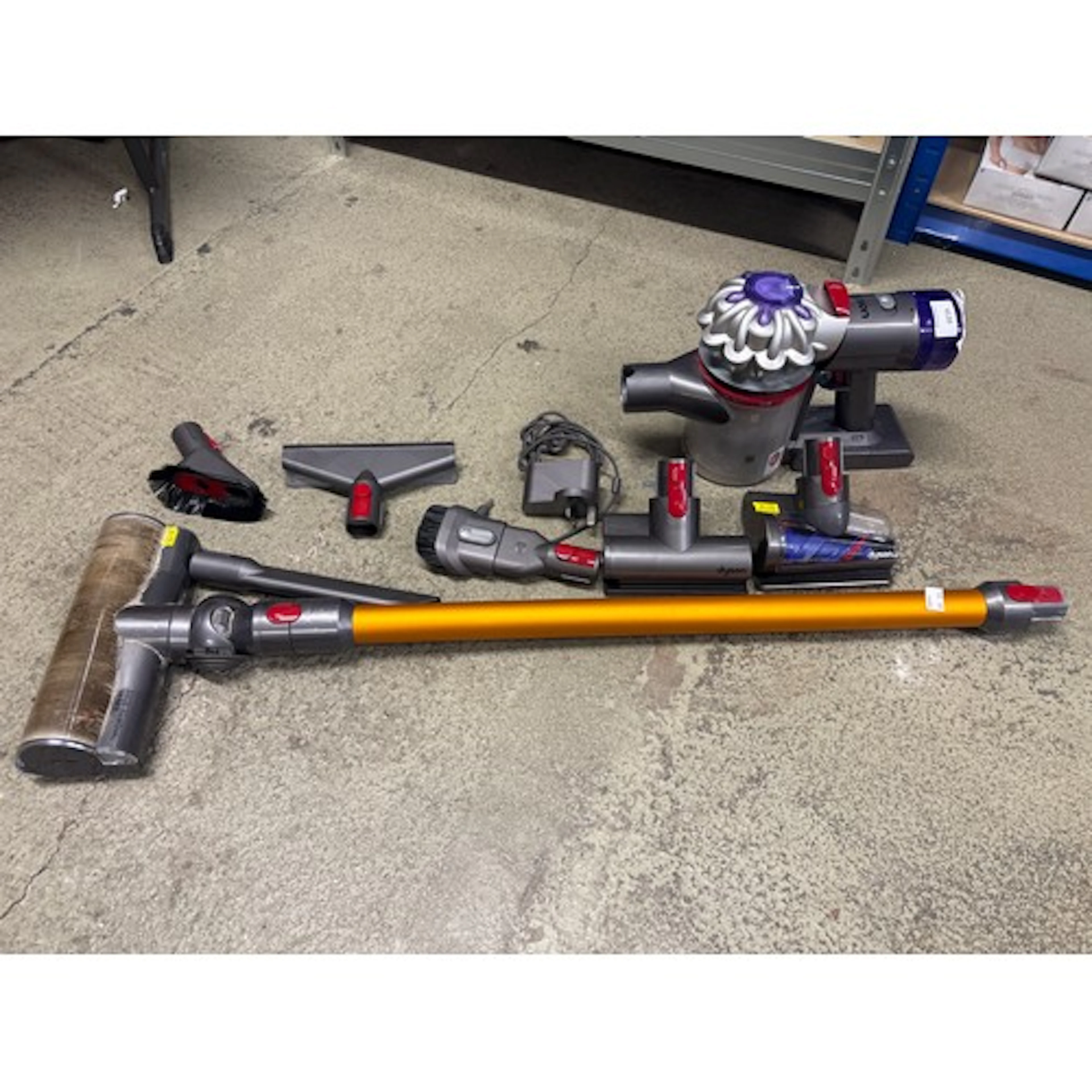 A Dyson V8 Absolute stick vacuum cleaner with charger, origi...