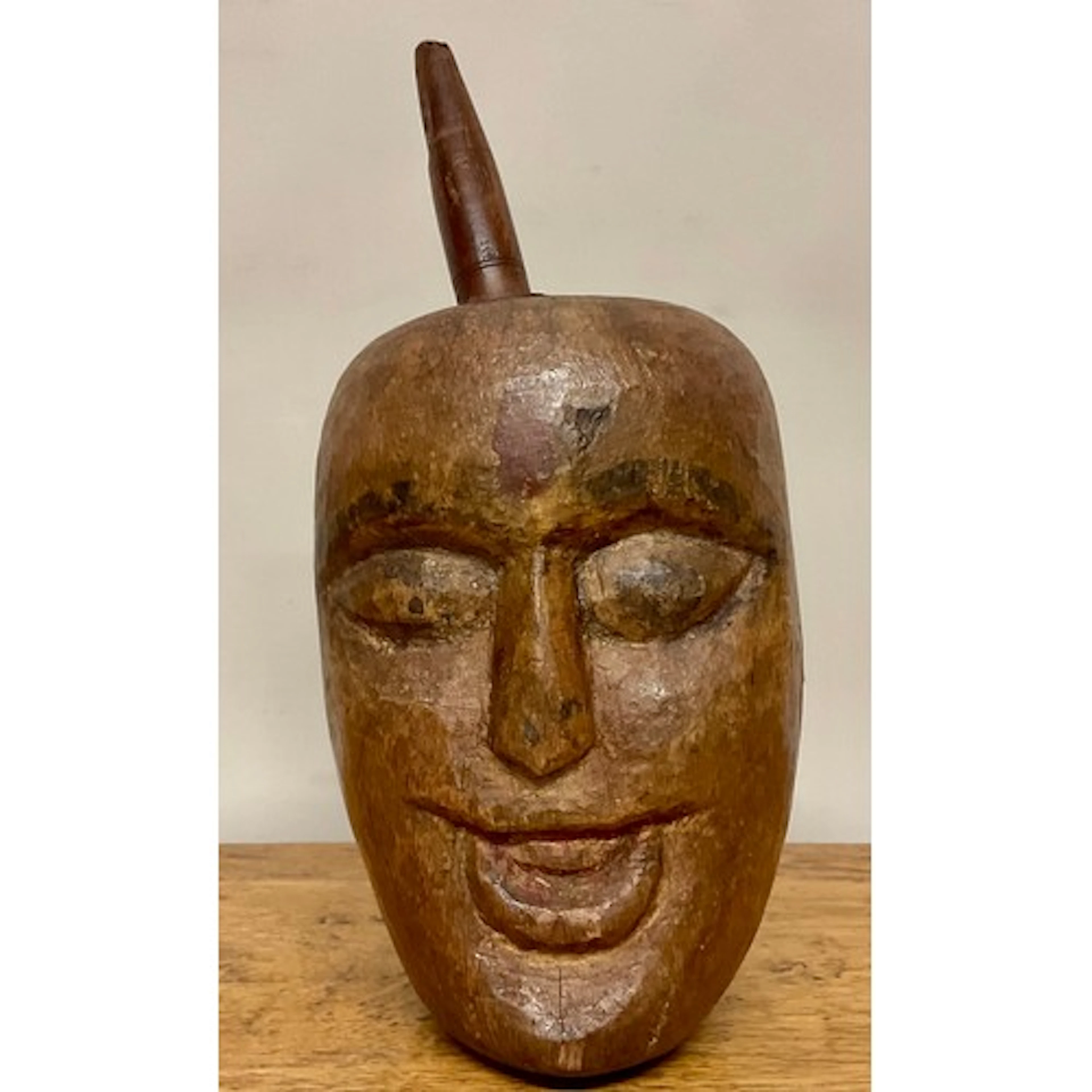 Tribal Art - an African mortar, carved with janus faces, tr...