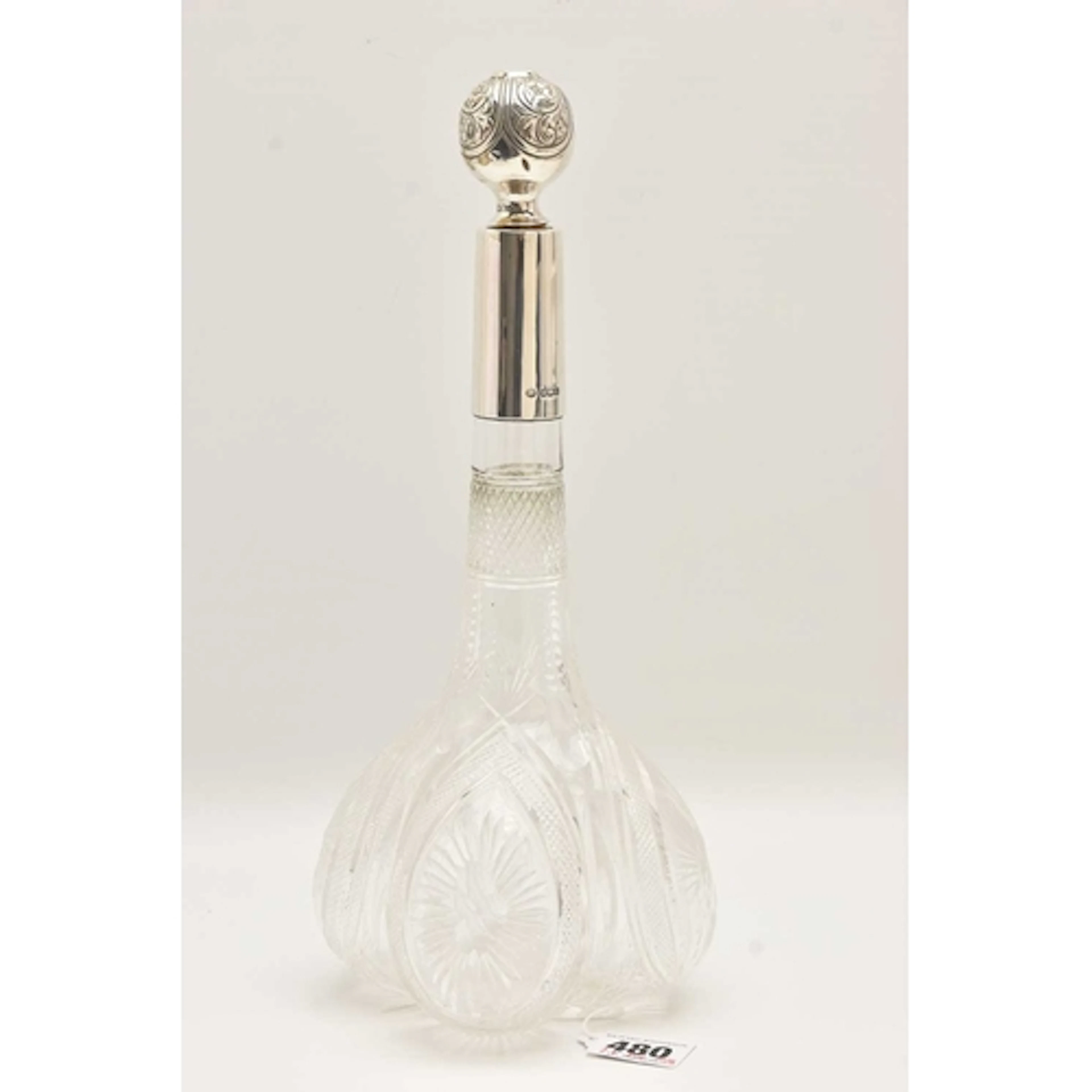 AN EARLY 20TH CENTURY, SILVER MOUNTED FANCY CUT GLASS DECANT...