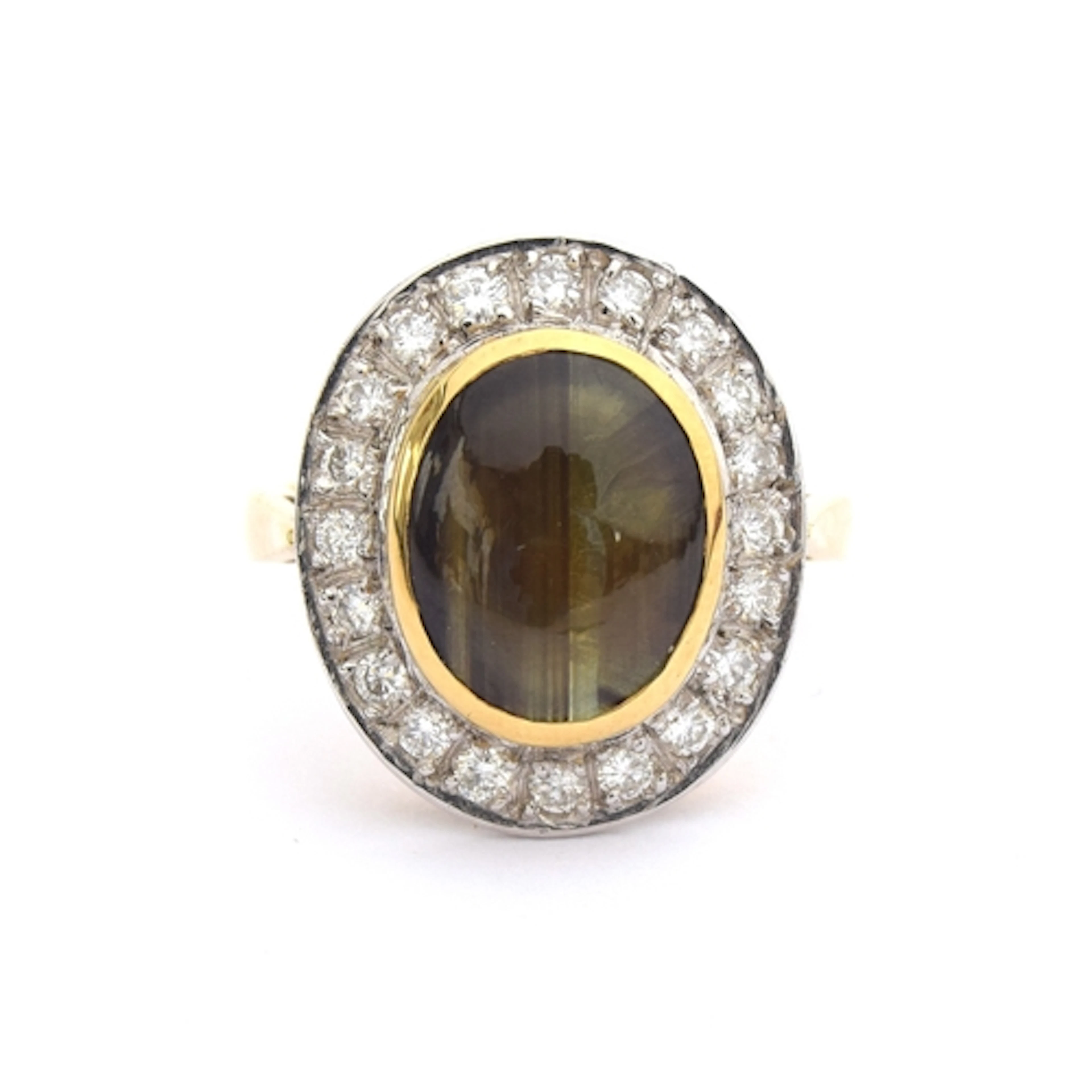 An 18ct gold, diamond and star sapphire cabochon cluster rin...