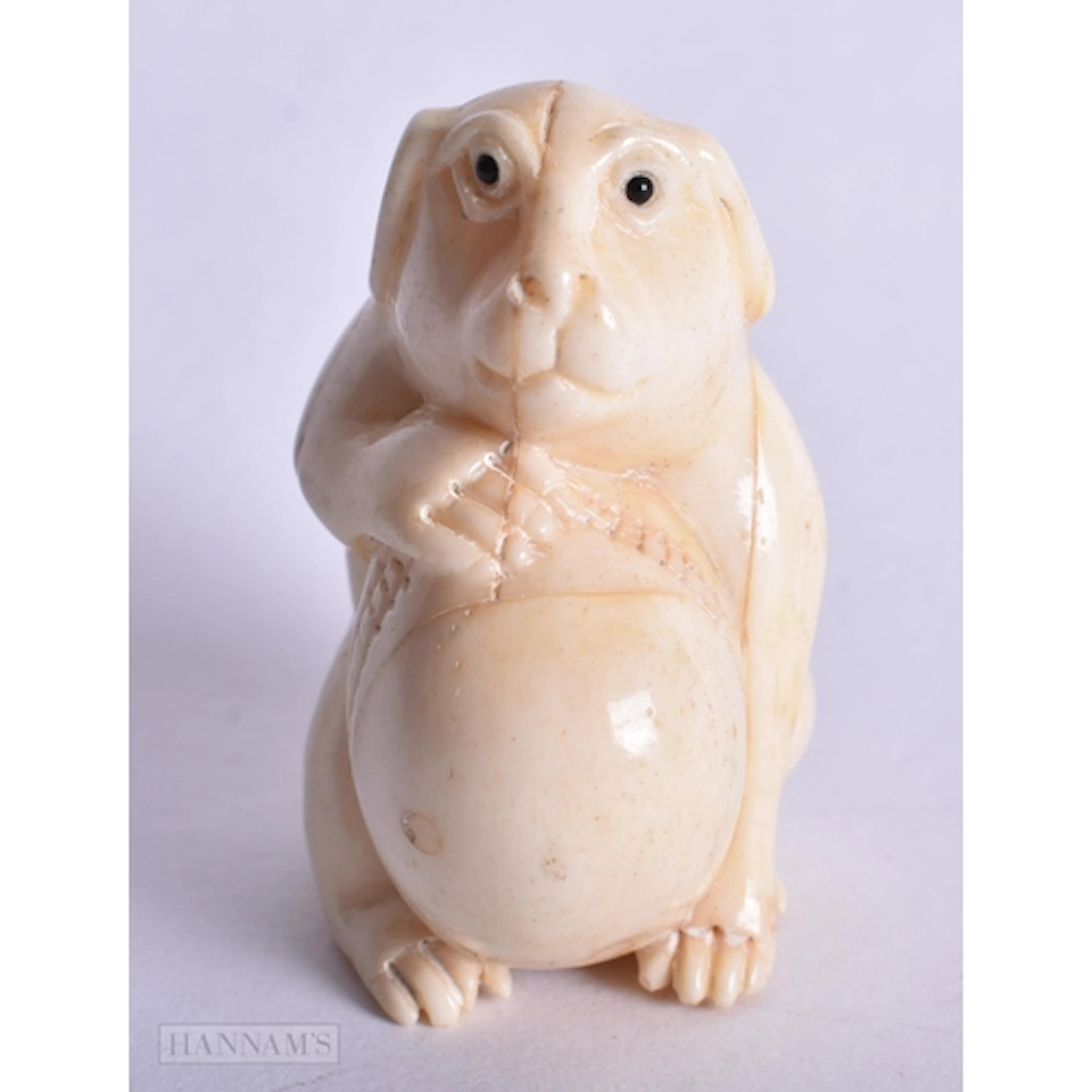 A BONE DOG NETSUKE. 4.5 x 3.3 x 2.7 cm