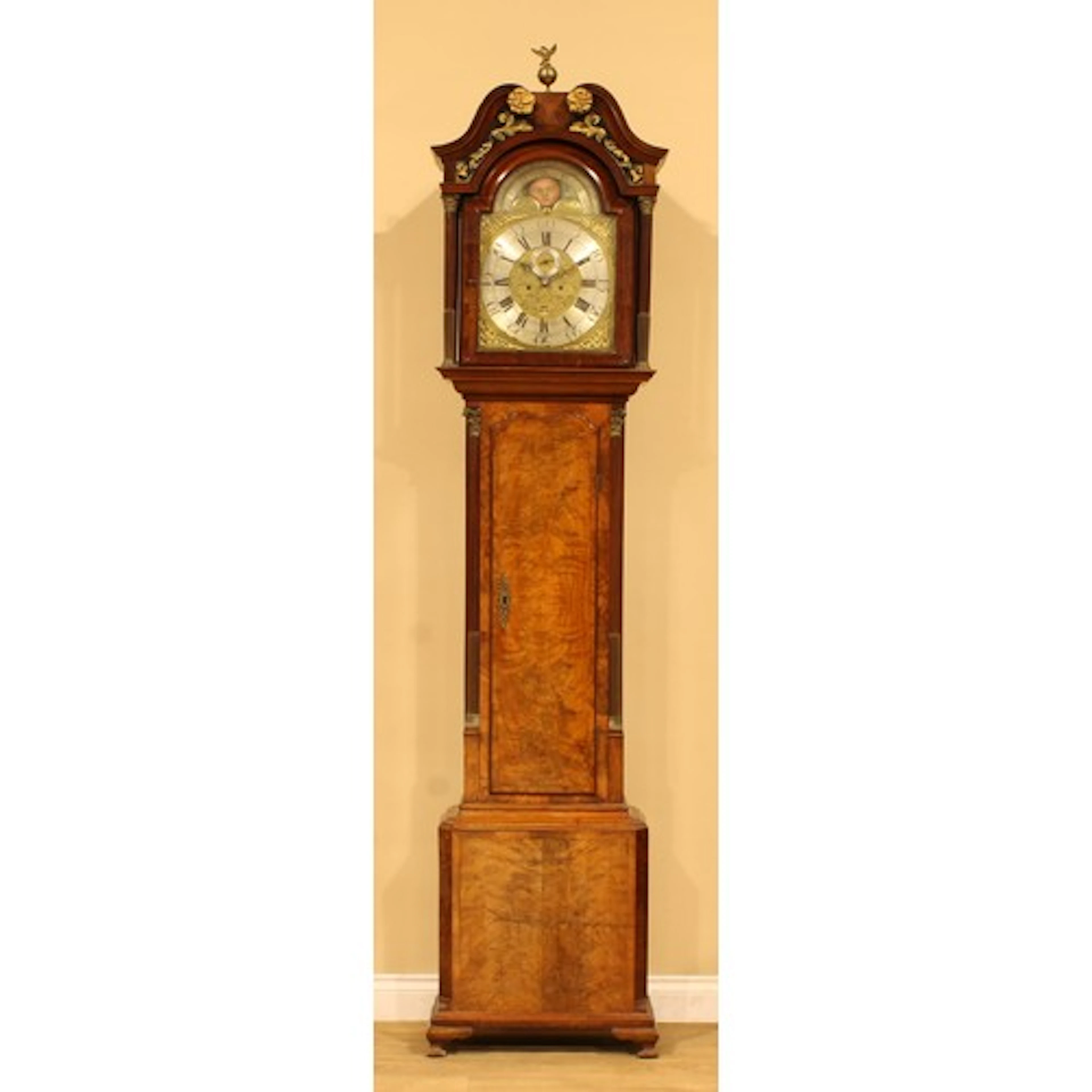 A George III mahogany longcase clock, 34cm arched brass dial...