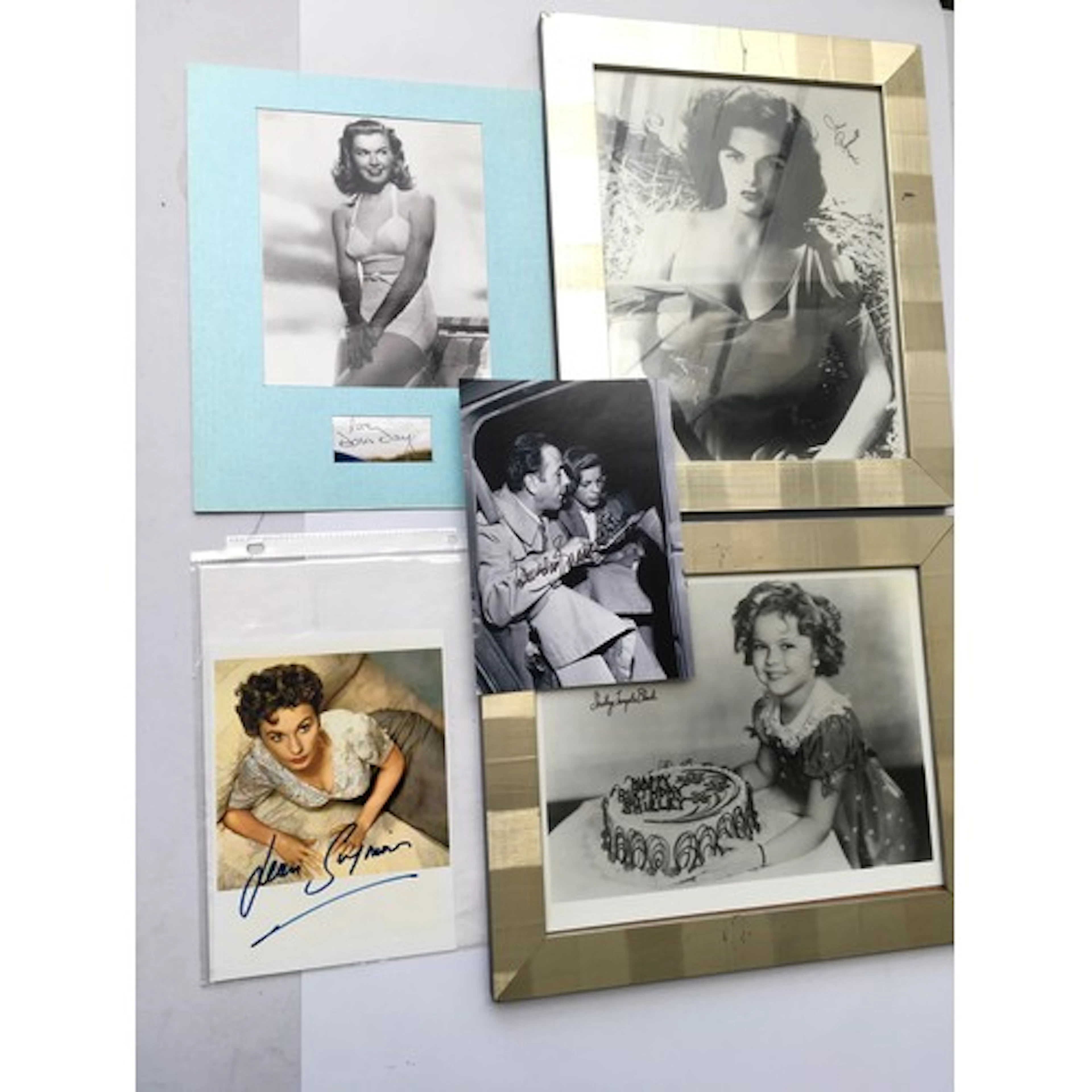 Five autographs comprising Jayne Russell, Lauren Bacall, Jea...
