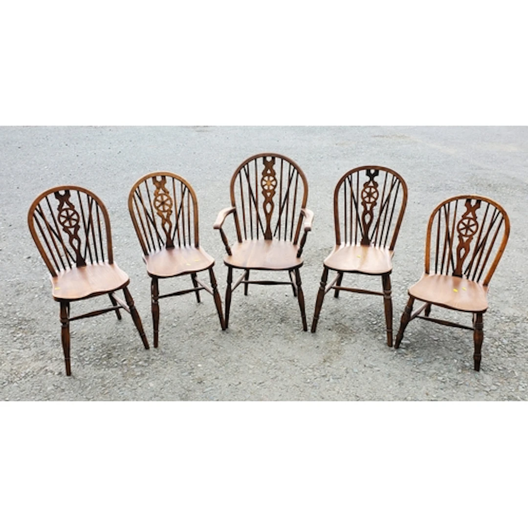 A matched set of six oak wheelback Dining chairs comprising ...