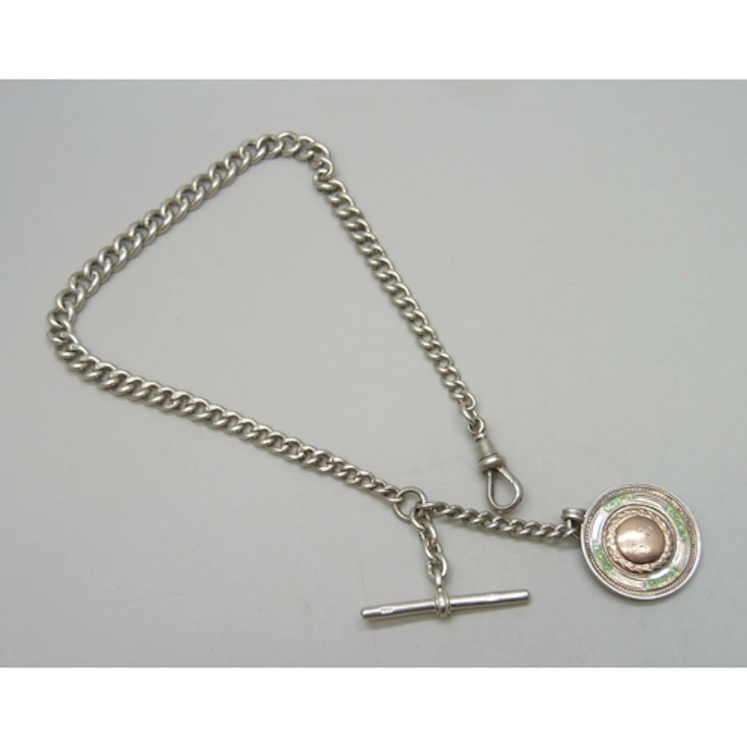 A silver Albert chain with a silver, enamel and applied yell...